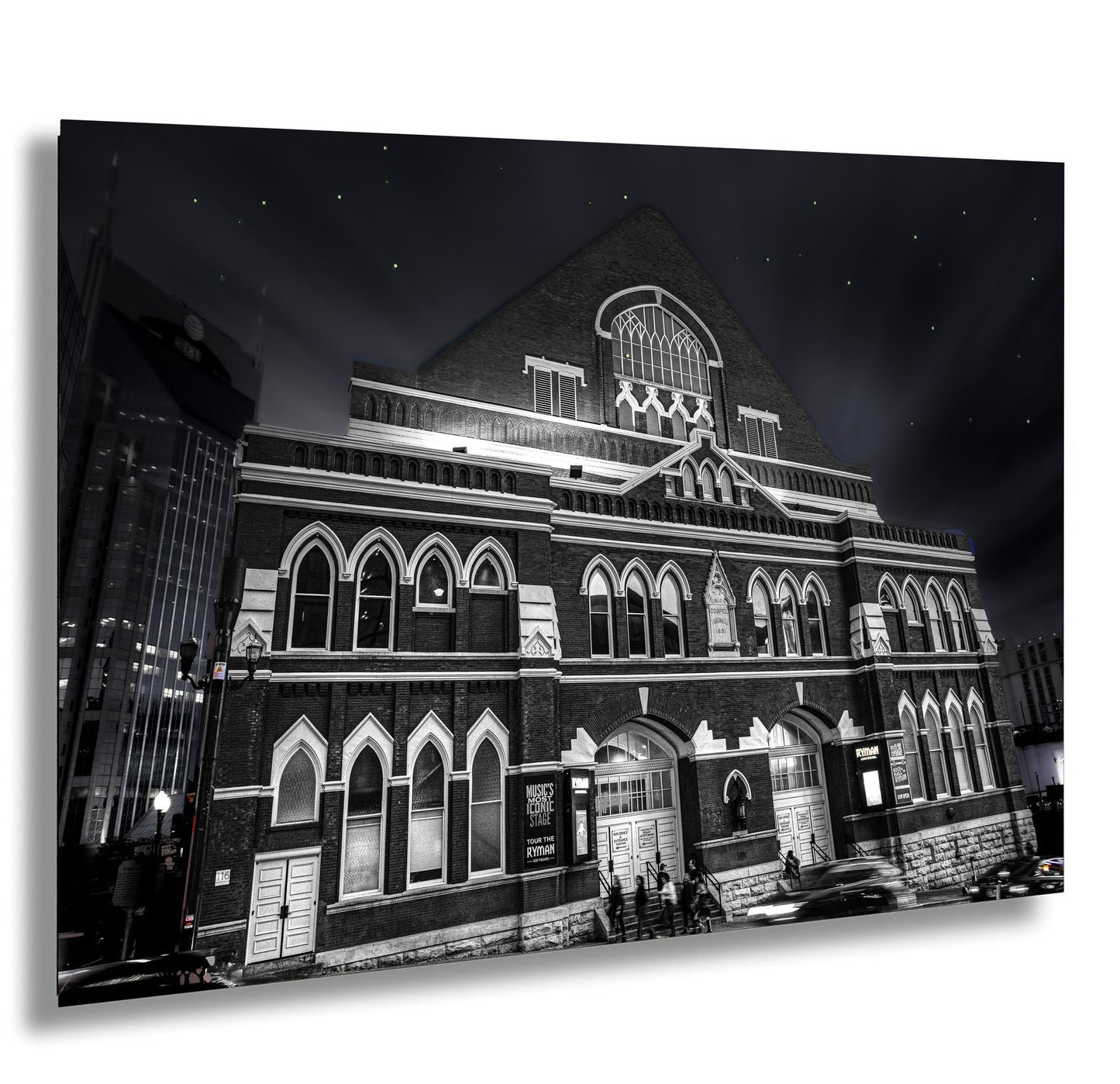 a black and white photo of a building at night