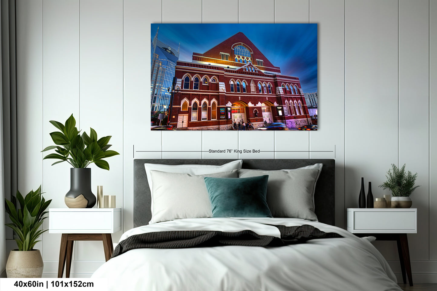 a bedroom with a bed and a painting on the wall