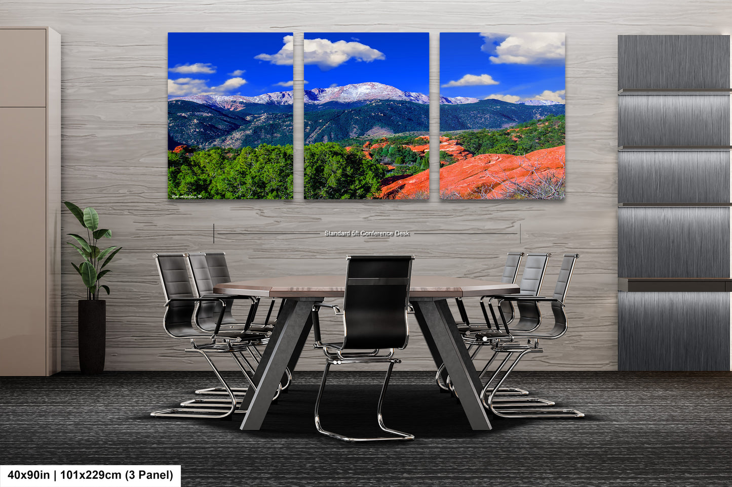 a dining room with a table and chairs with mountains in the background