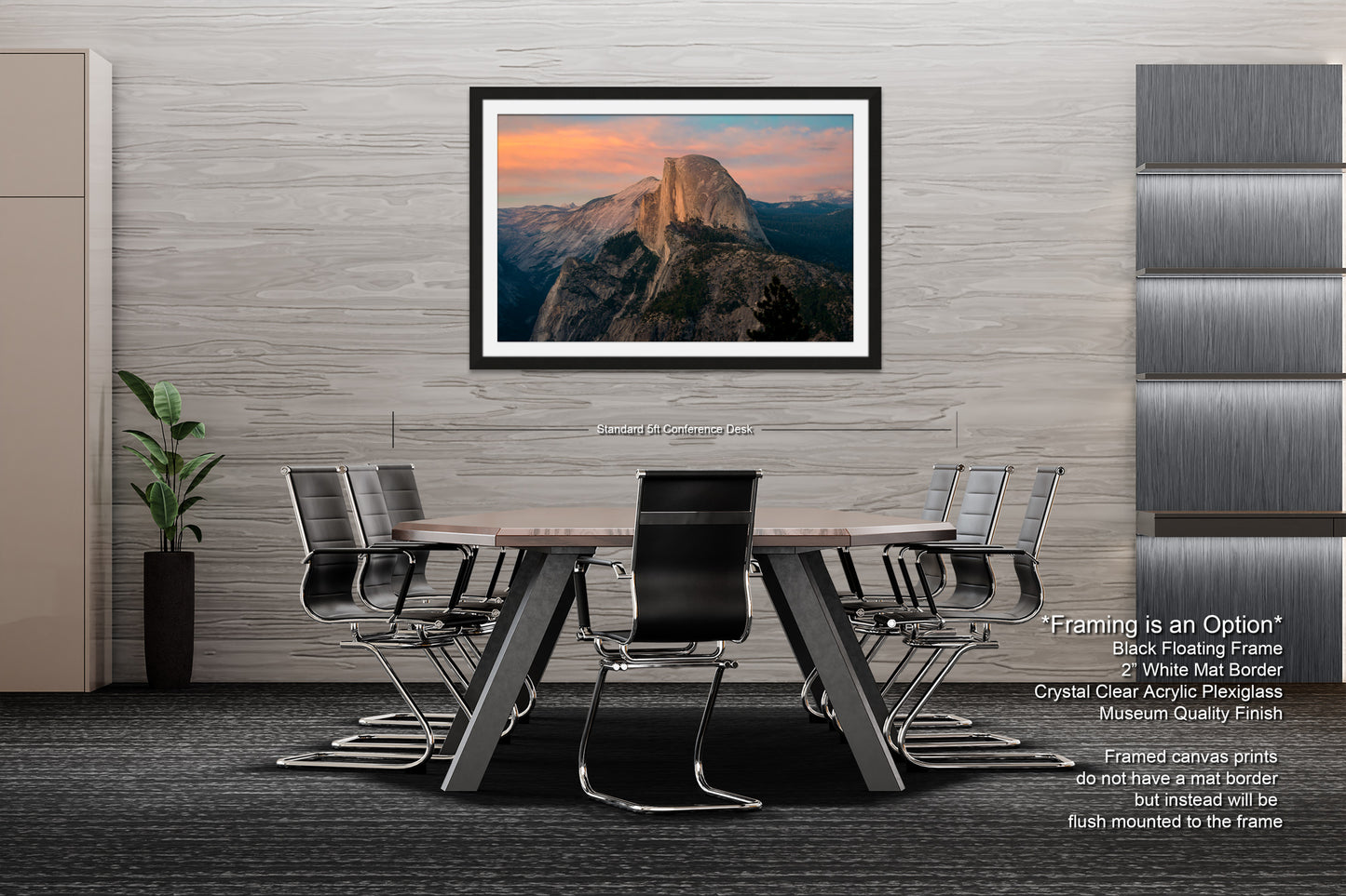 a dining room table with chairs and a picture hanging on the wall