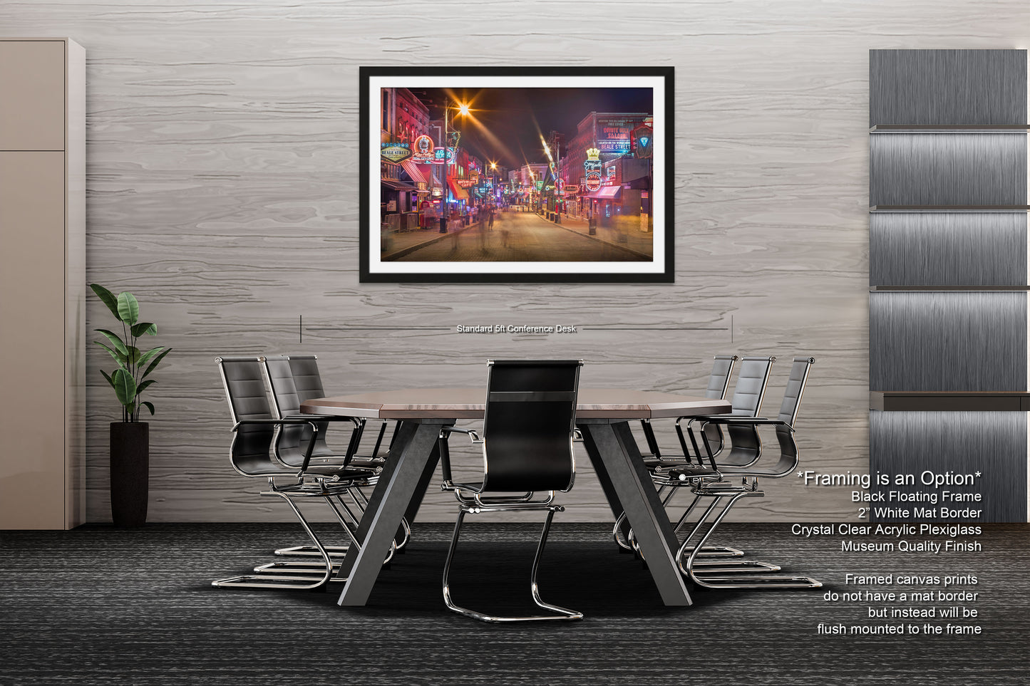 a dining room table with chairs and a picture hanging on the wall