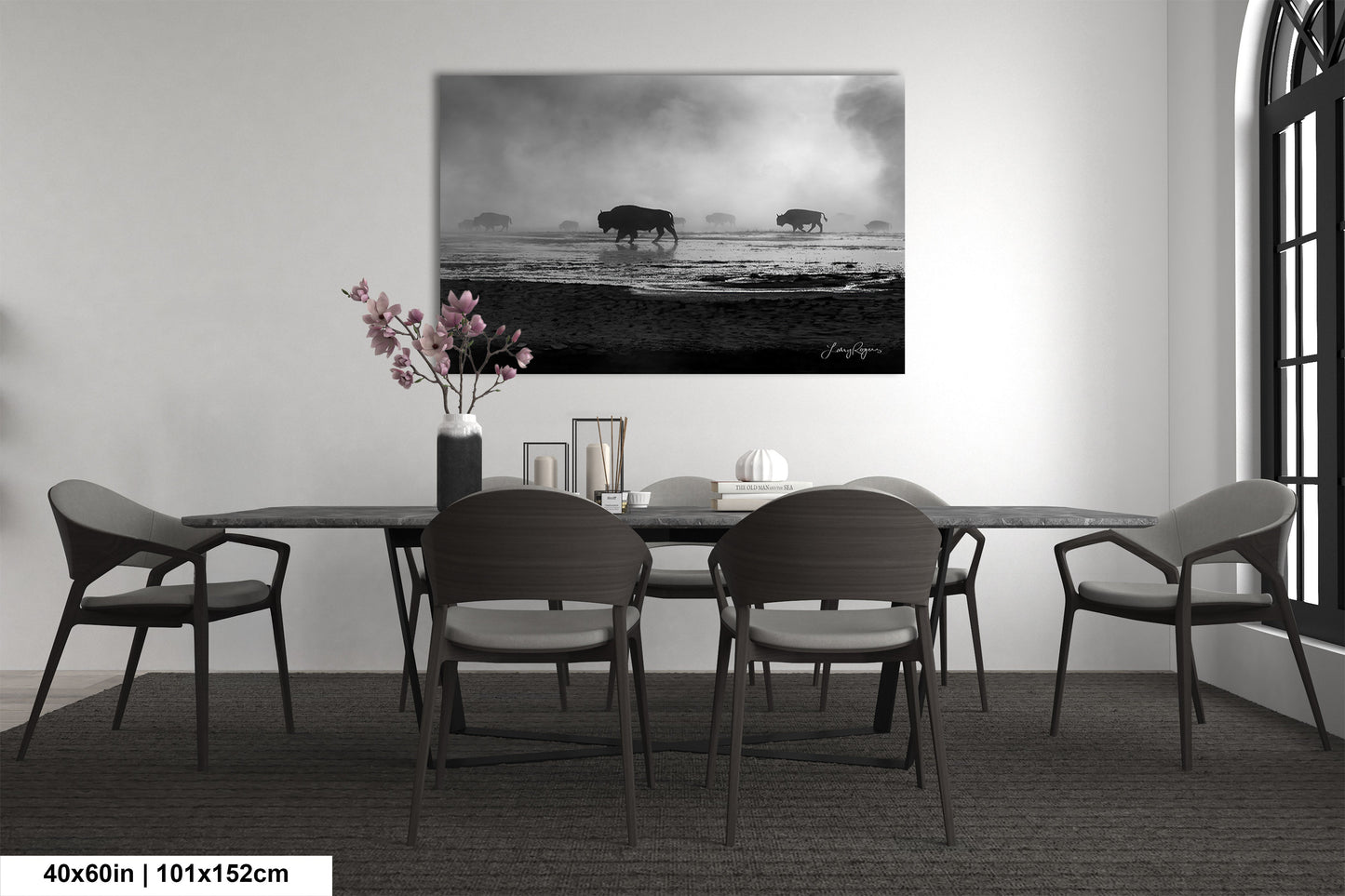a black and white photo of a dining room table