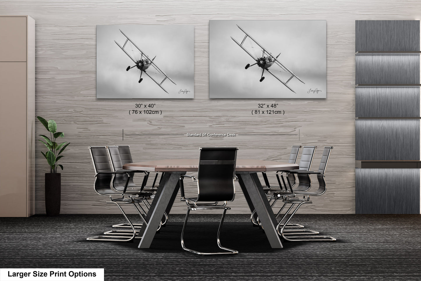 a dining room table with chairs and two pictures on the wall