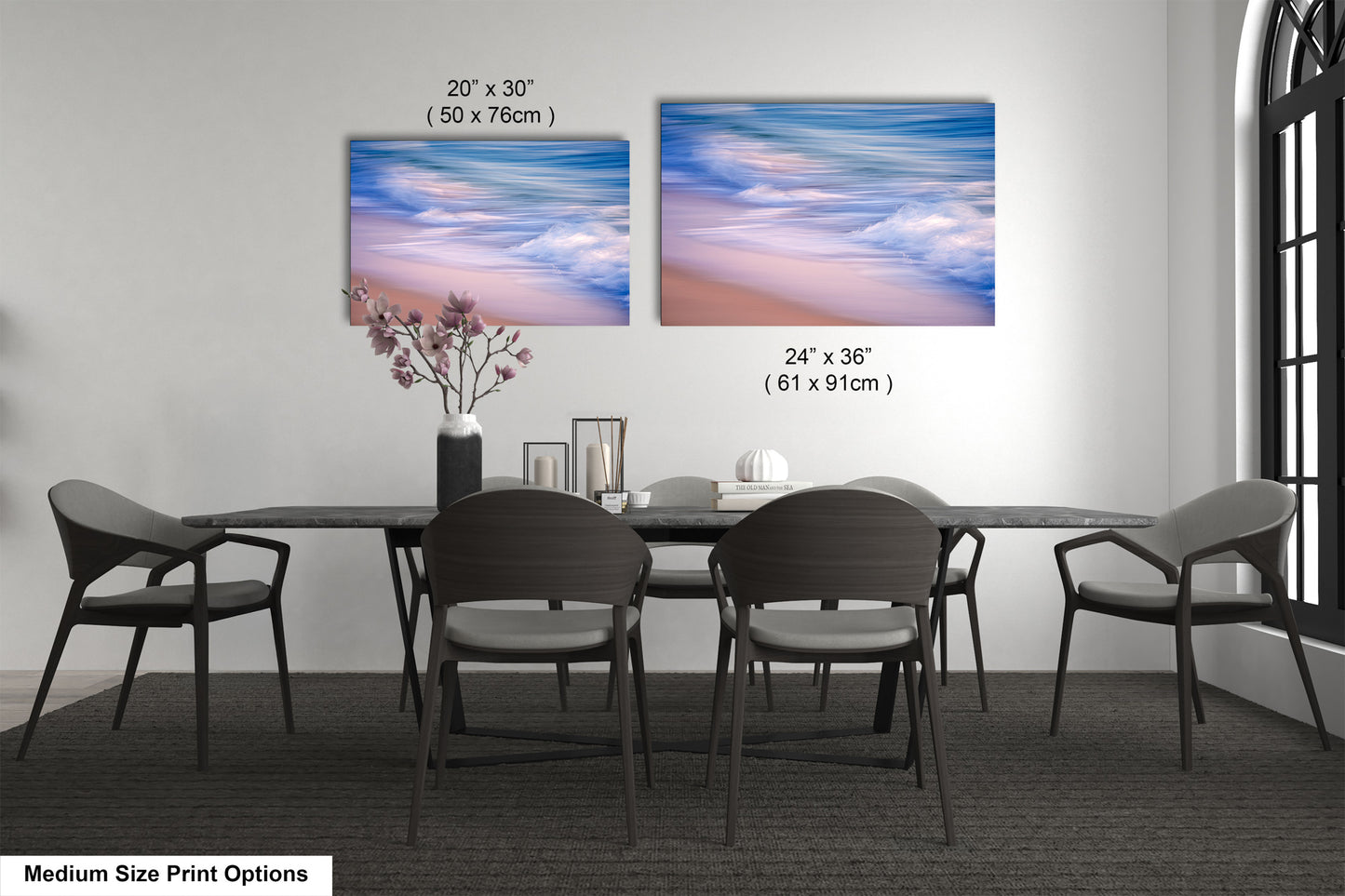 a dining room table with four chairs and a vase with flowers