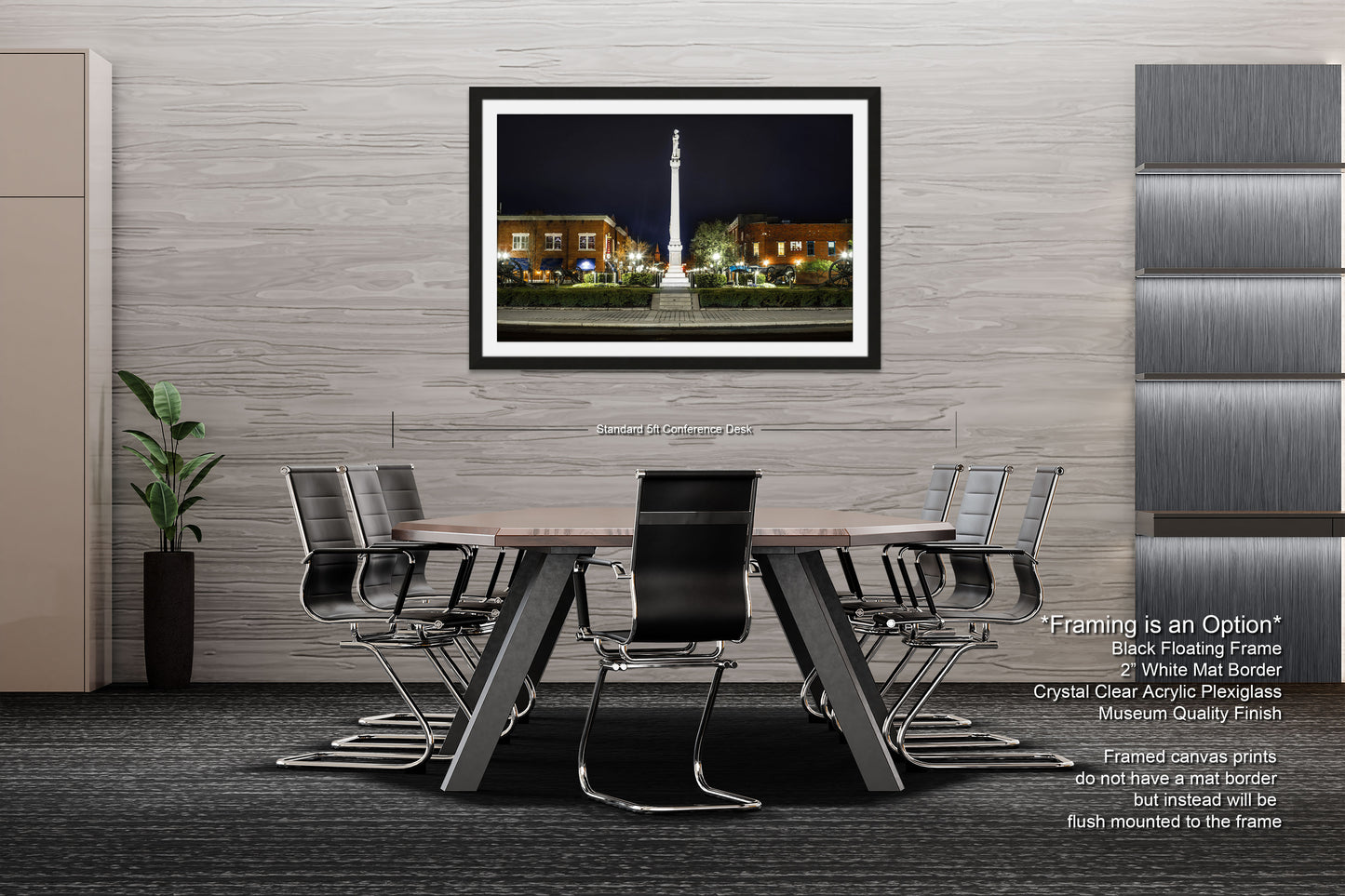 a dining room table with chairs and a picture hanging on the wall
