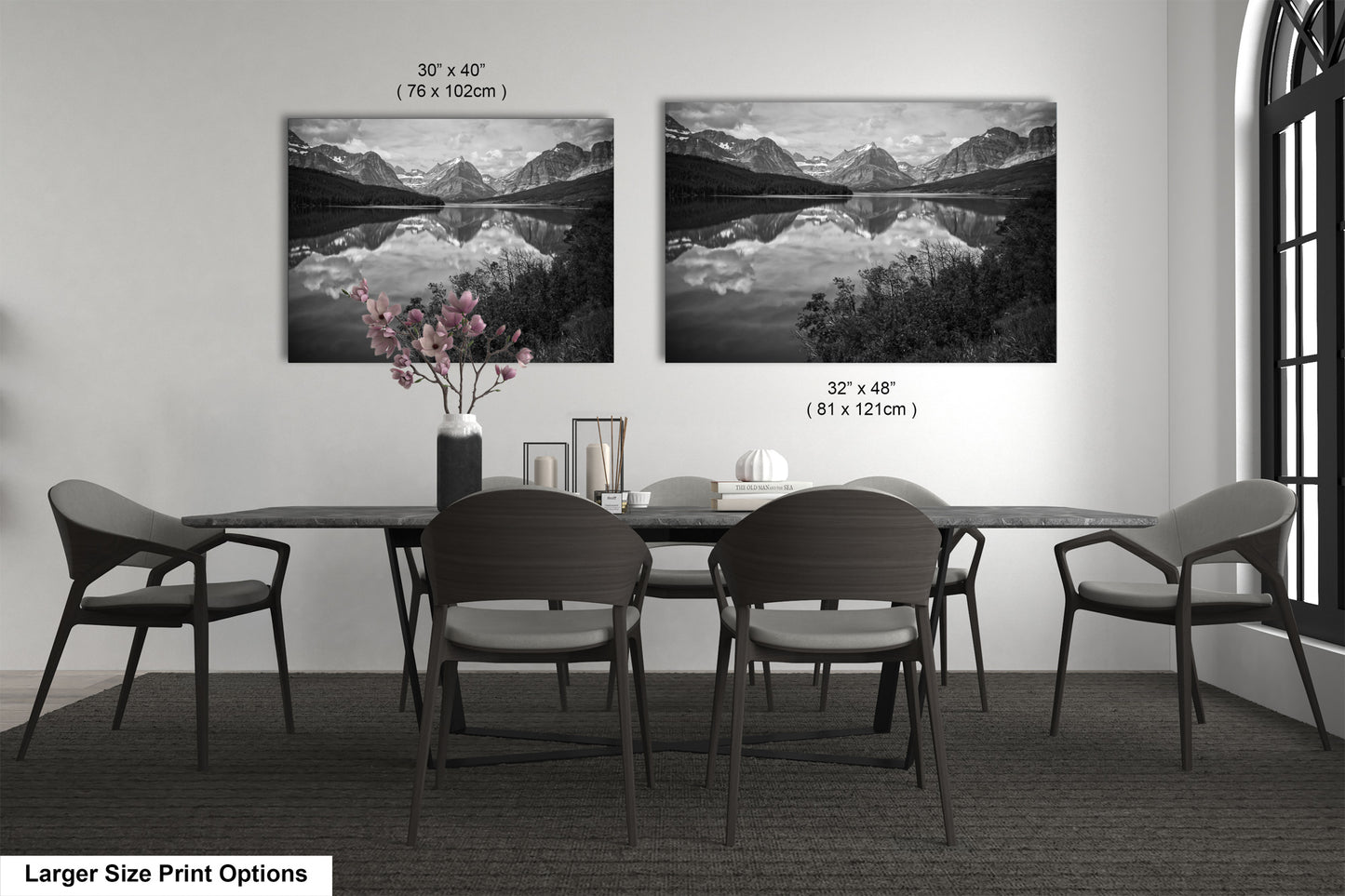 a black and white photo of a dining room table
