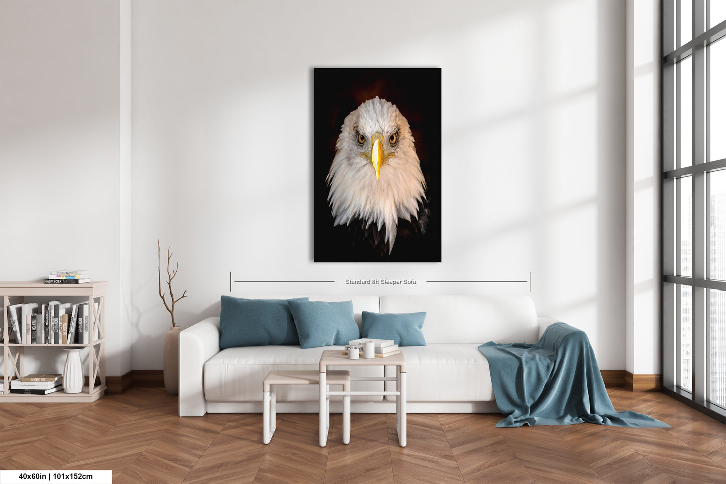 a living room with a white couch and a painting of an eagle