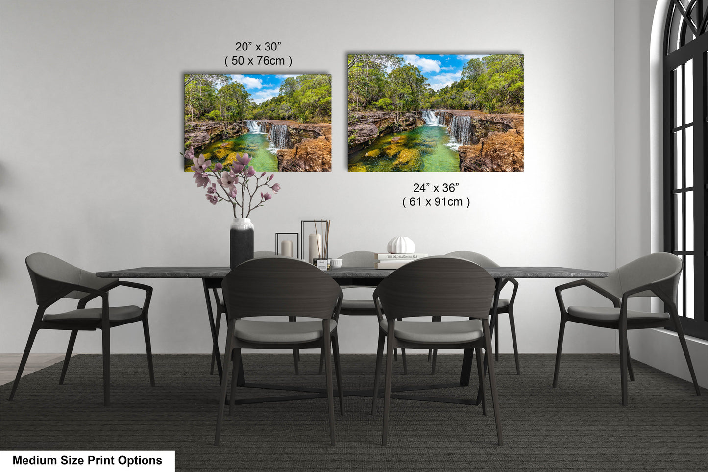 a dining room table with chairs and a vase with flowers