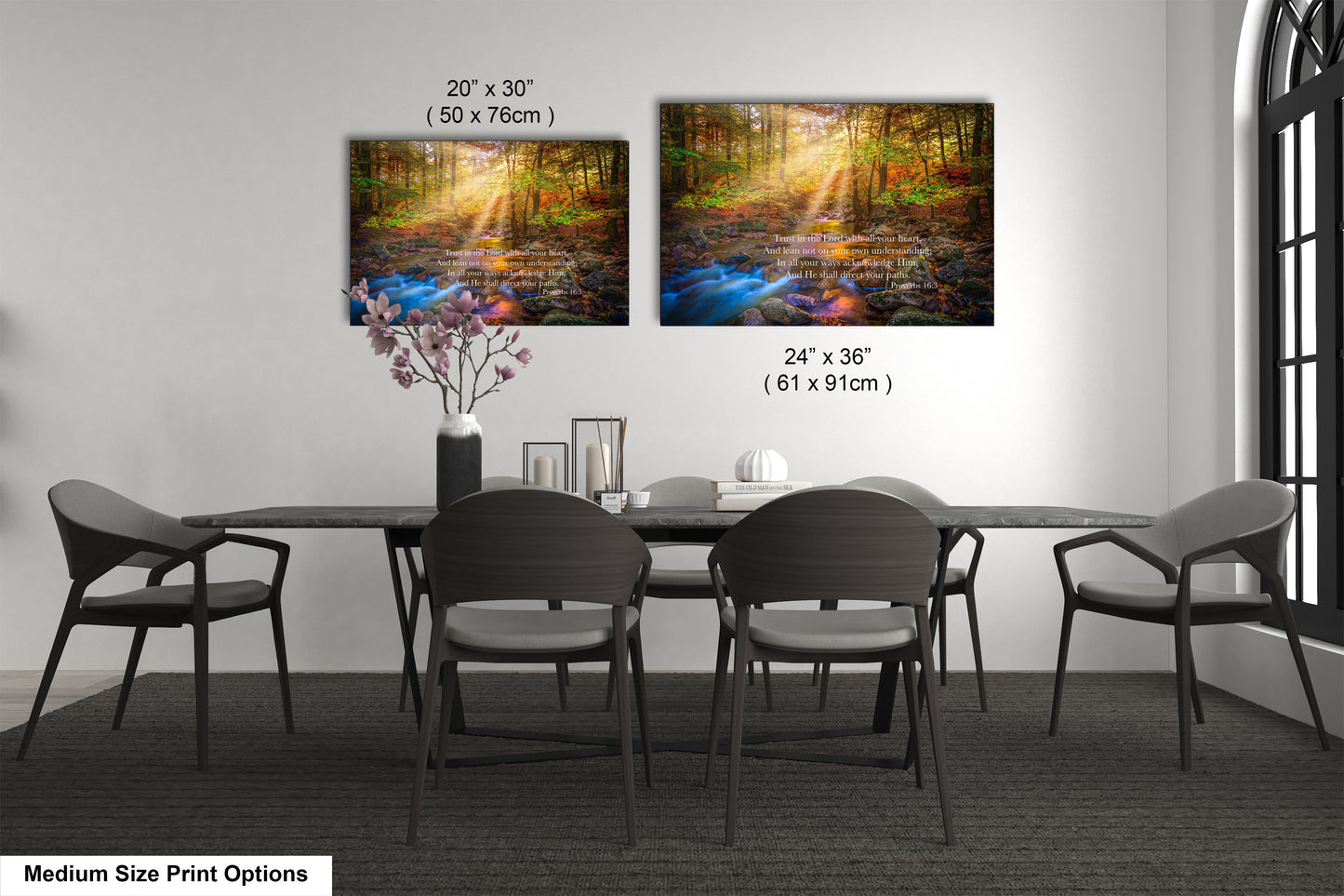 a dining table with four chairs and a vase of flowers