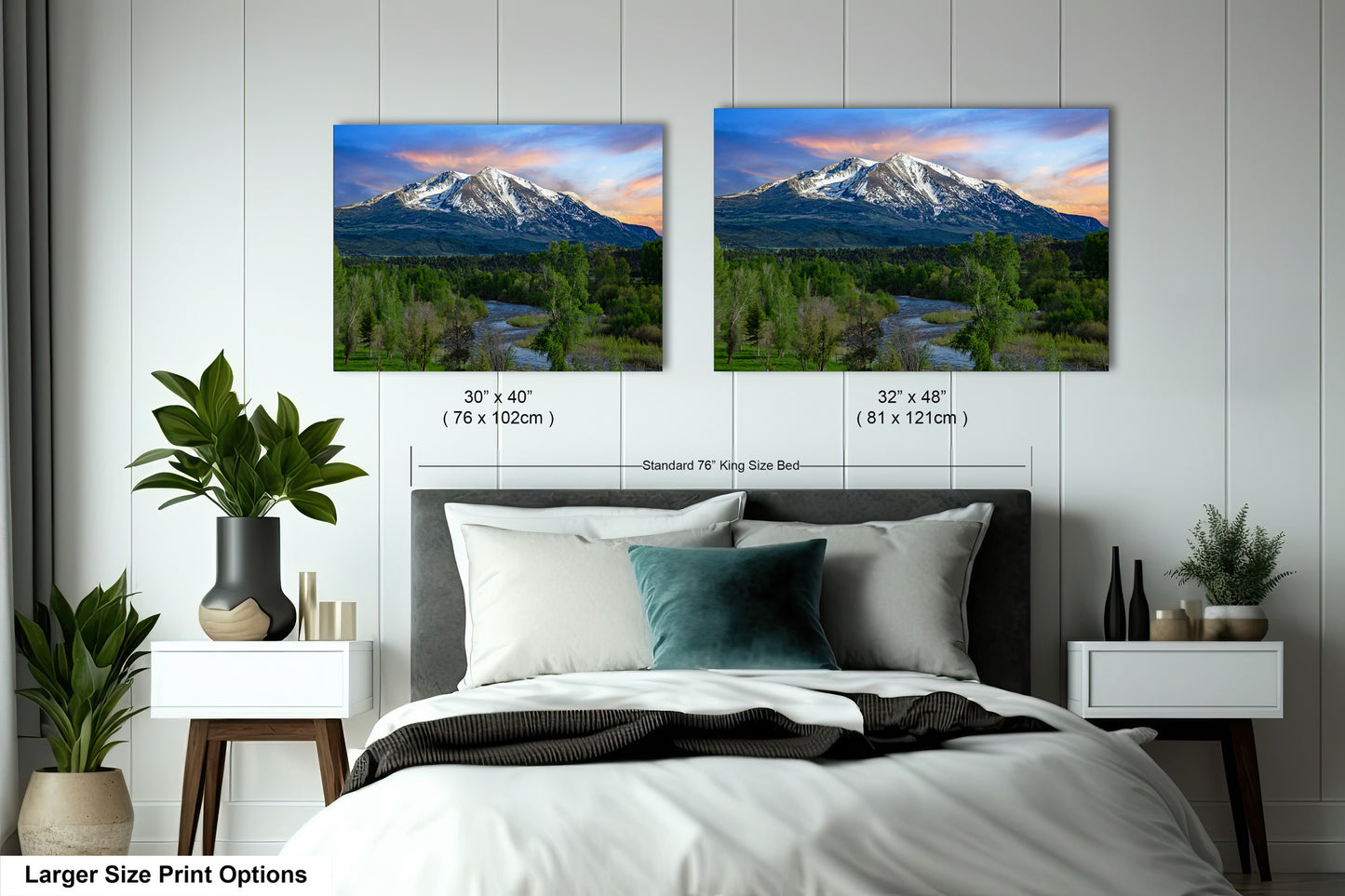a bedroom with a bed and two pictures on the wall