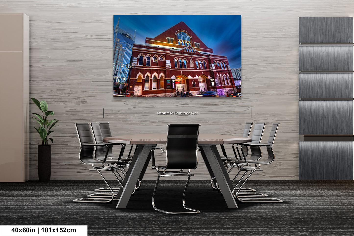 a table and chairs in a room with a painting on the wall