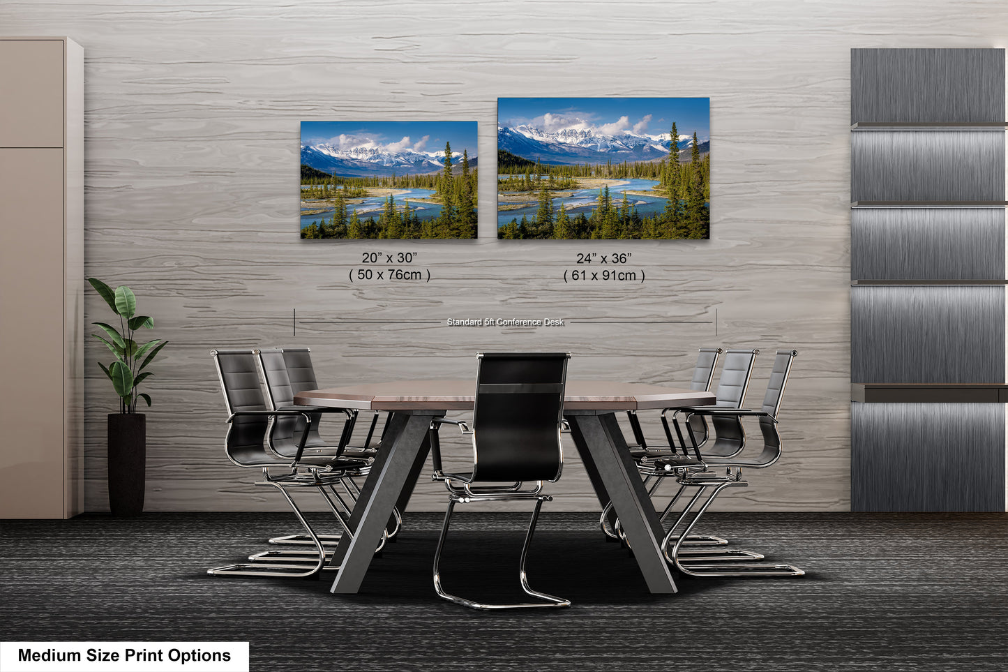 a dining room table with chairs next to a wall with two pictures of mountains