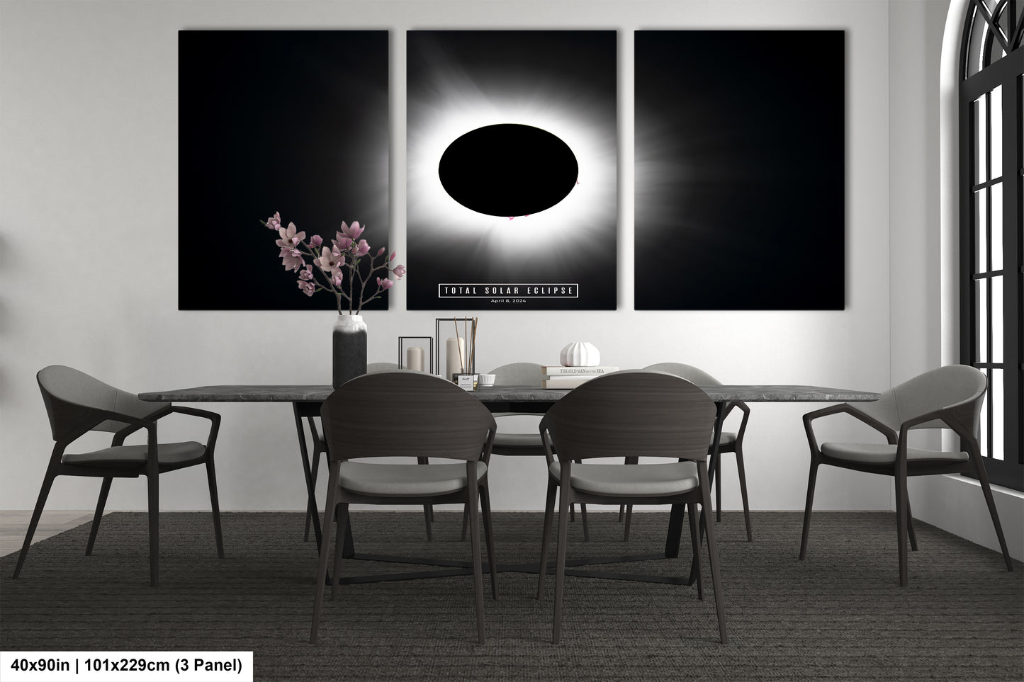 a black and white photo of a dining room