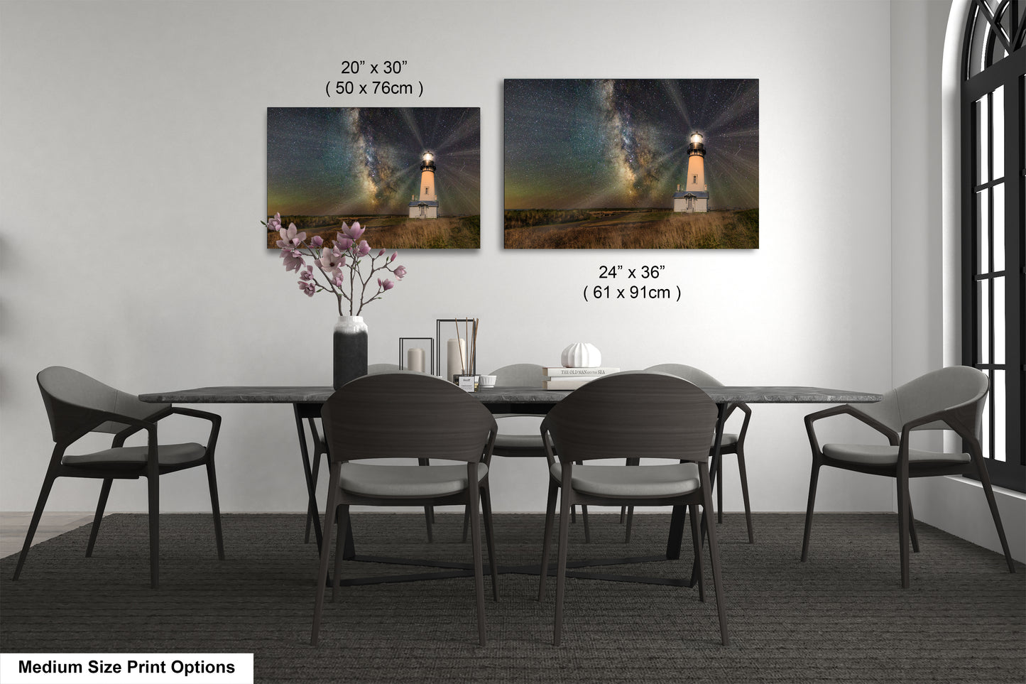 a dining room table with four chairs and a vase of flowers