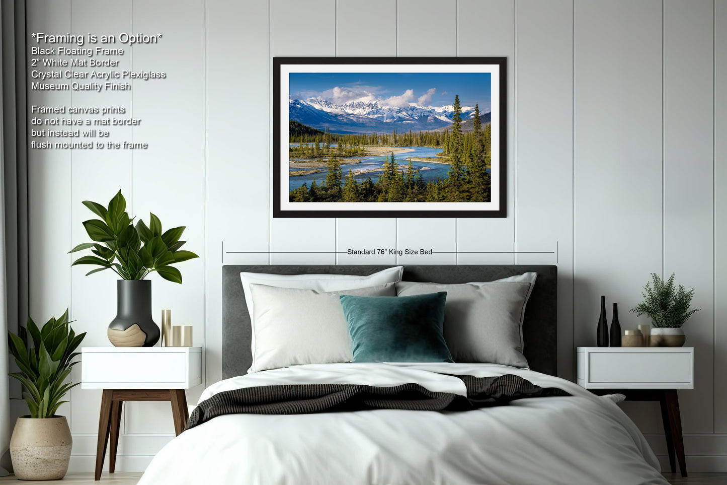 a bedroom with a large bed and a picture hanging on the wall