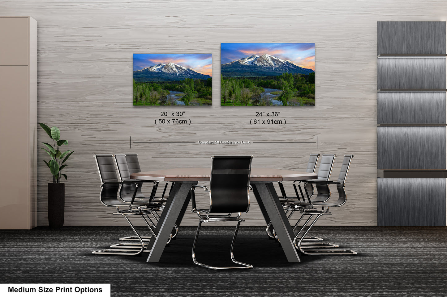 a dining room table with chairs and two pictures of mountains