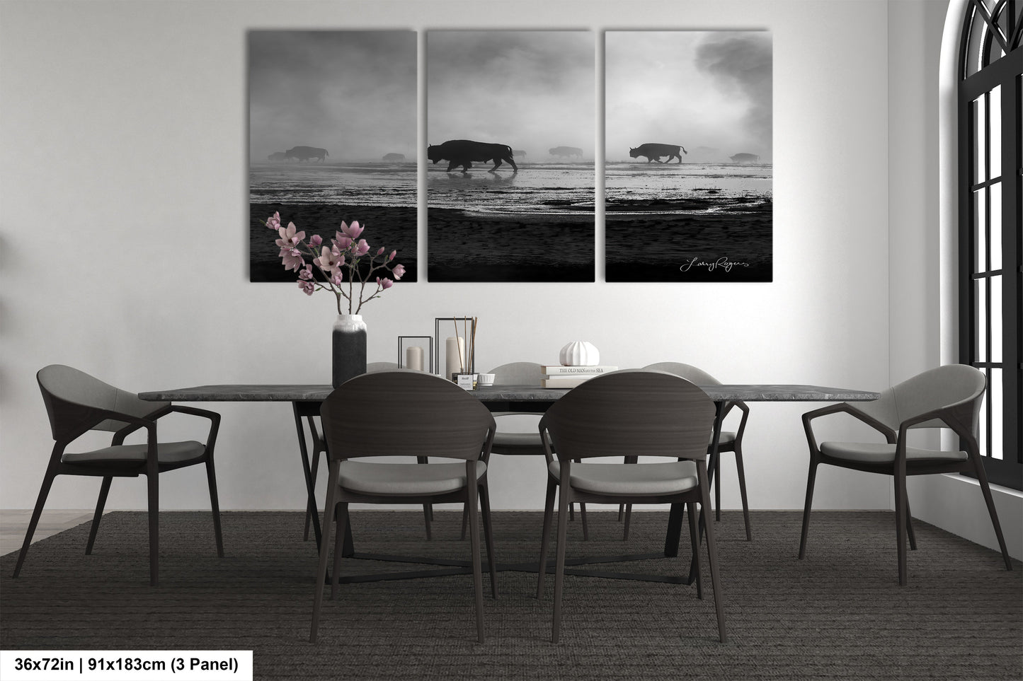 a black and white photo of a dining room table