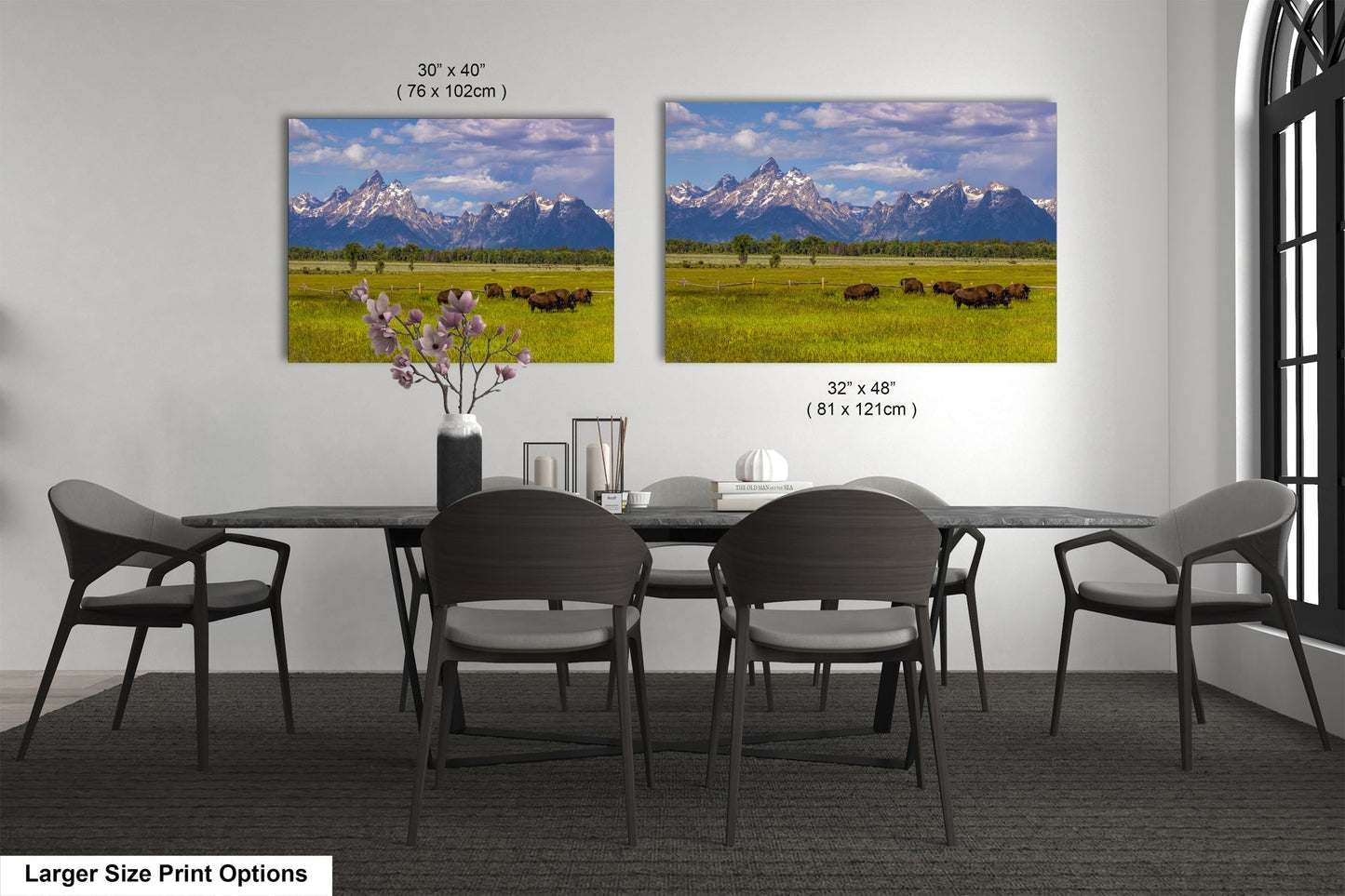 a dining room table with four chairs and a vase of flowers