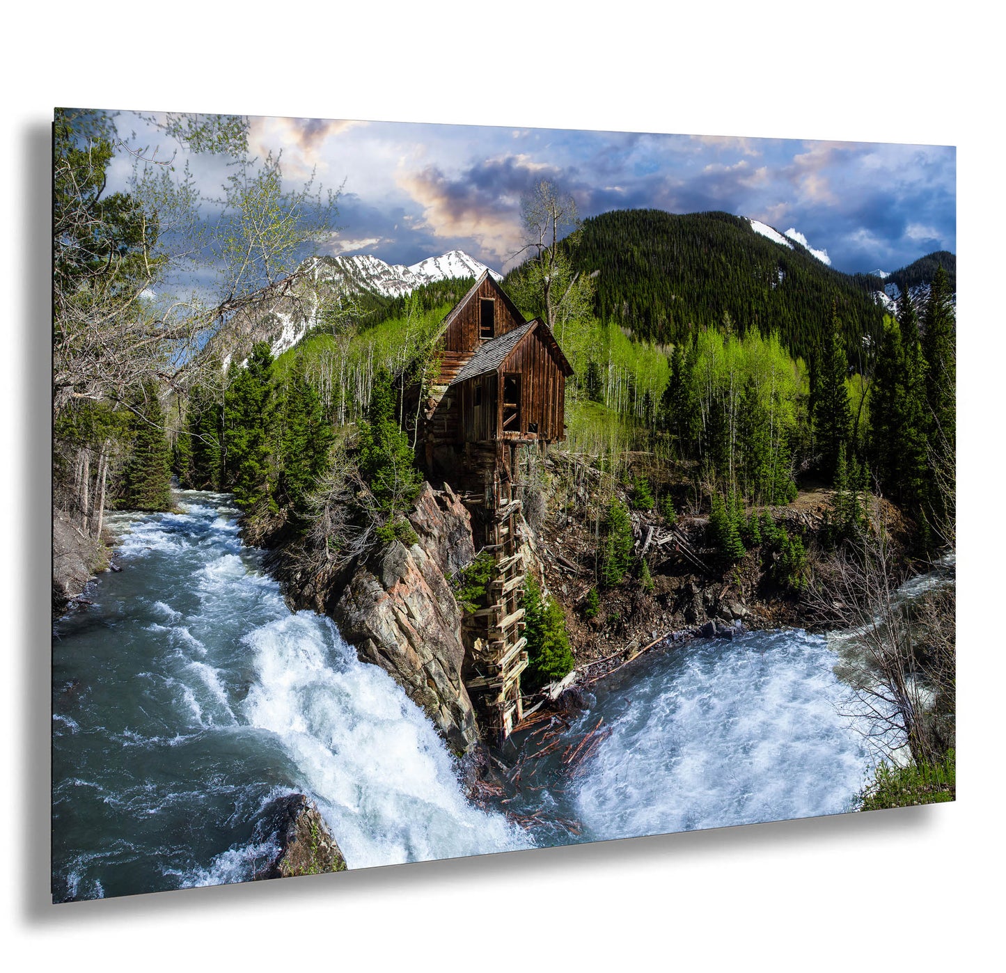 a painting of a cabin on a cliff next to a river