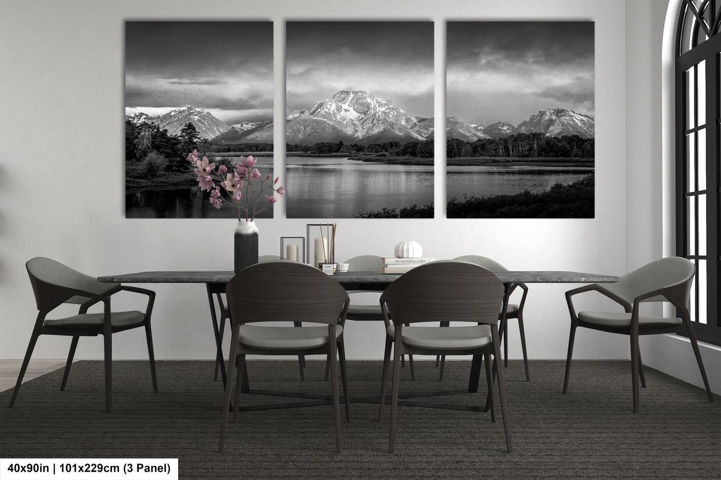 a black and white photo of a dining room table