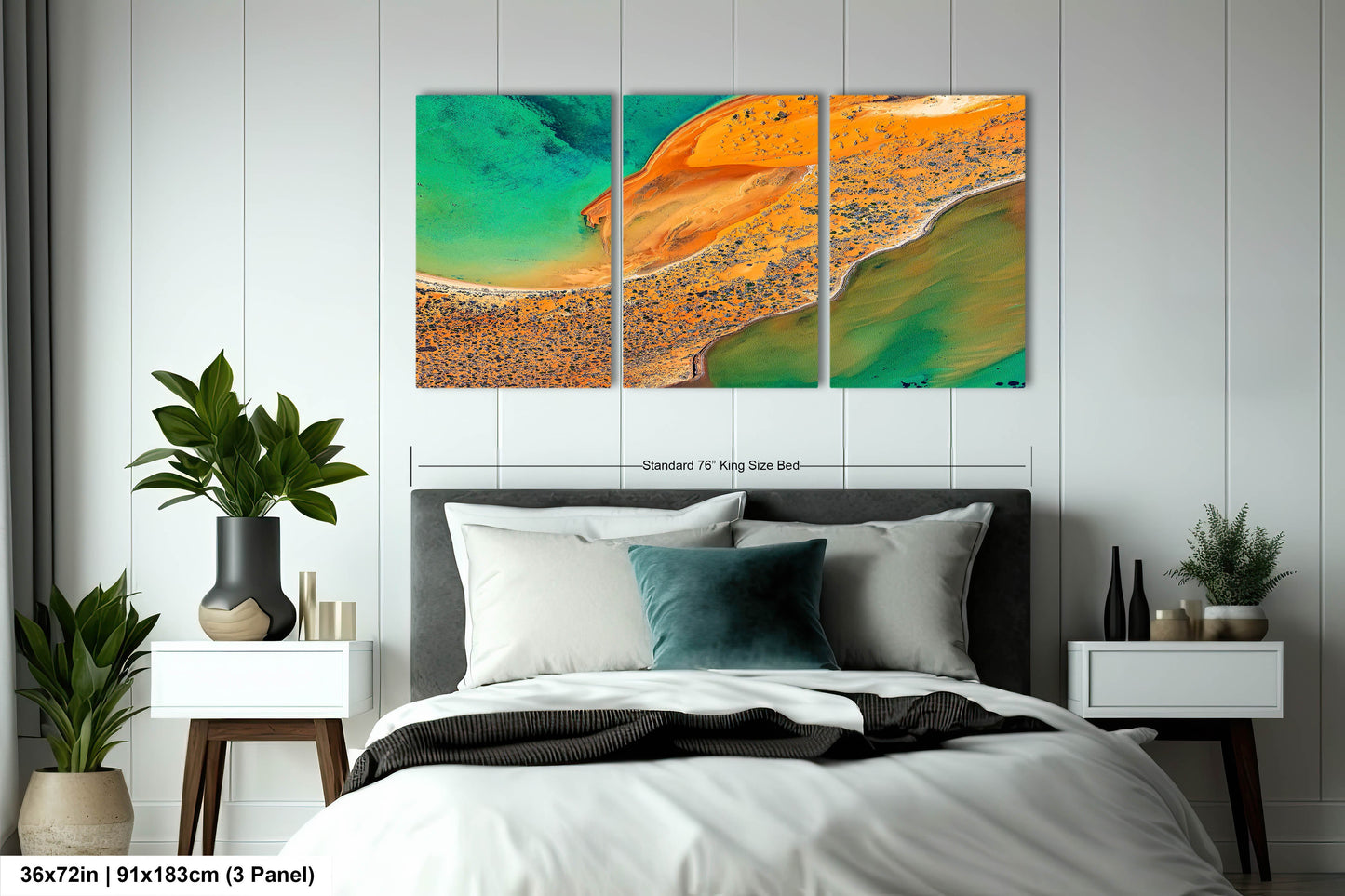 a bedroom with a bed and two paintings on the wall