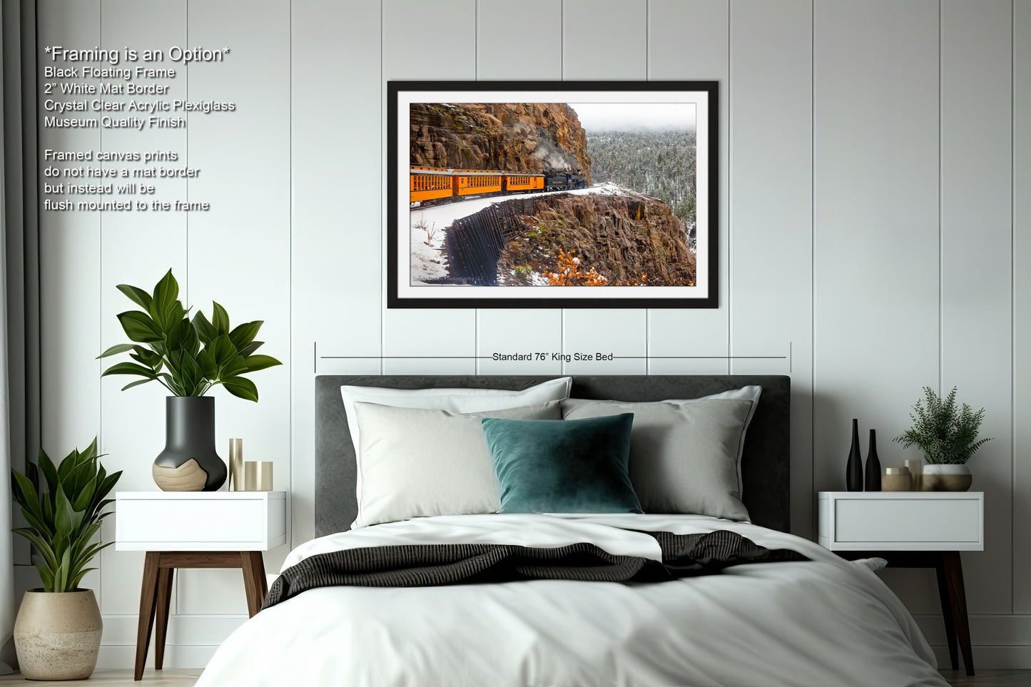 a bedroom with a bed and a picture on the wall
