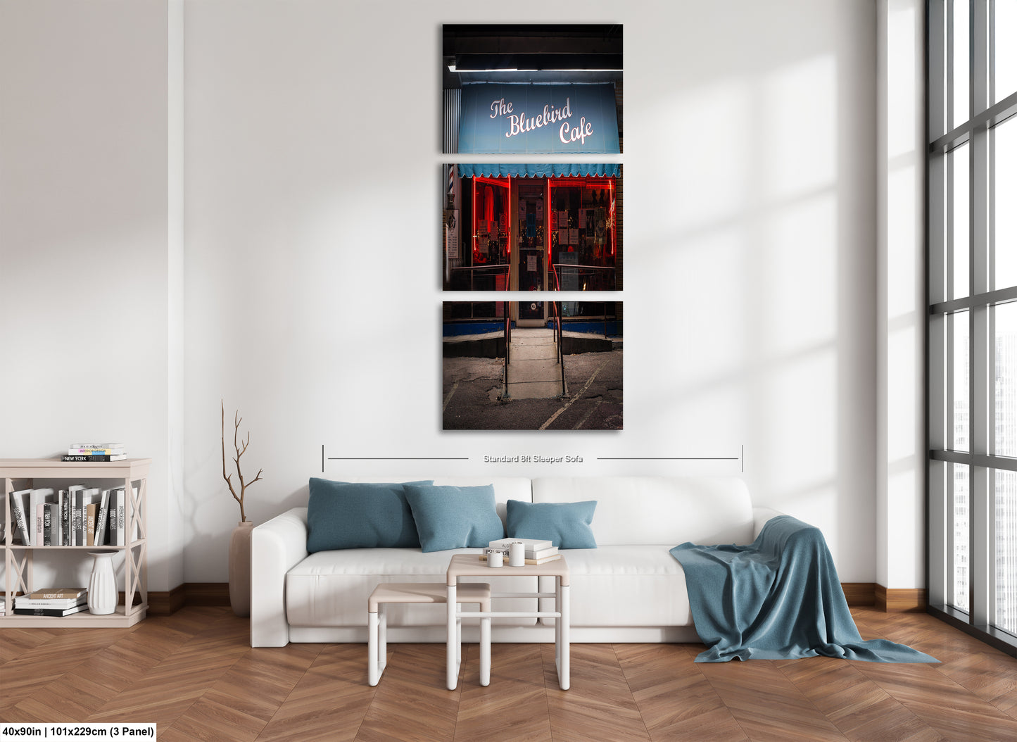 a living room with a white couch and a window