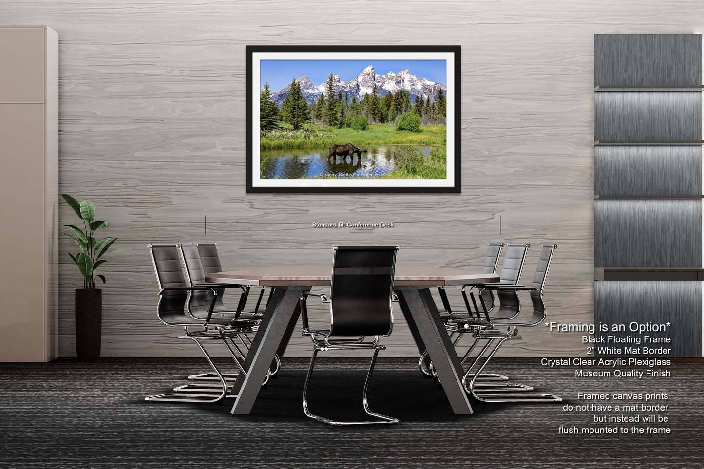 a dining room table with chairs and a picture hanging on the wall