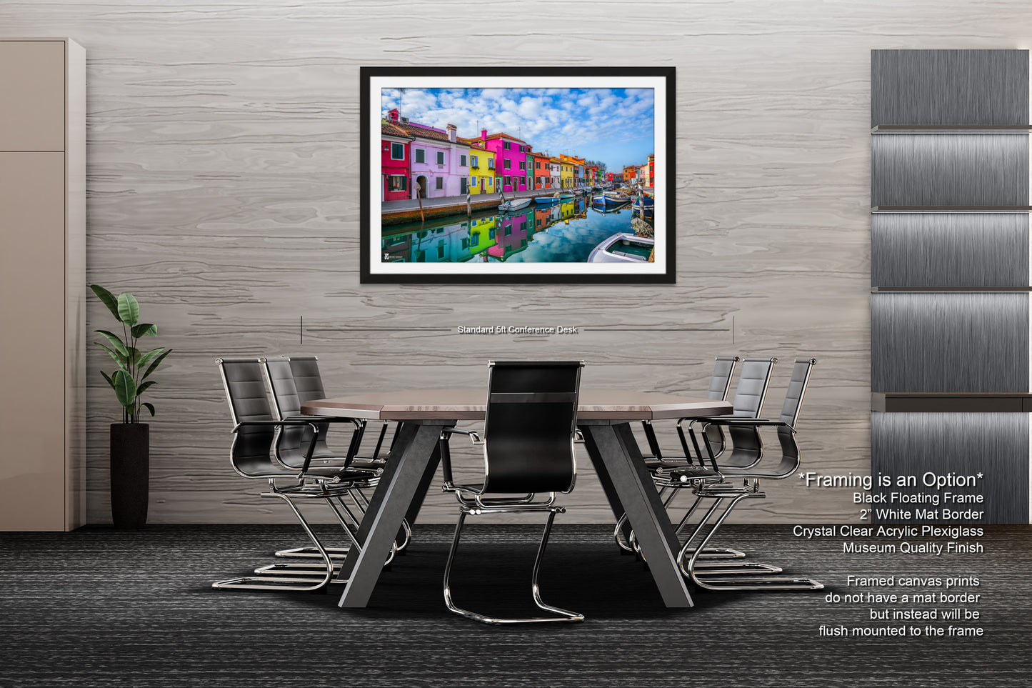 a dining room table with chairs and a picture hanging on the wall