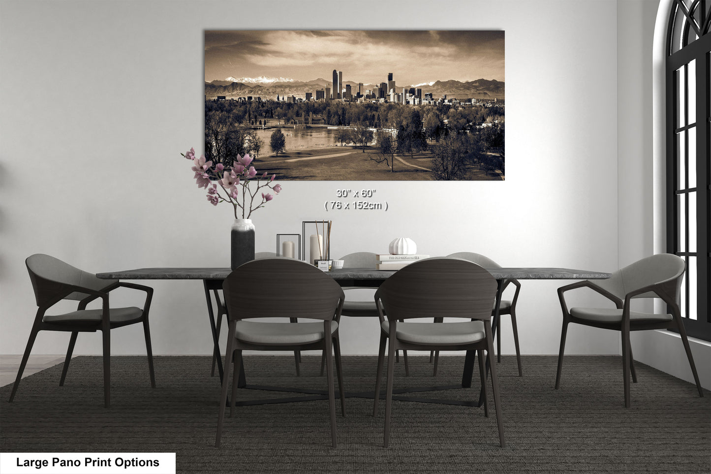 a black and white photo of a dining room table