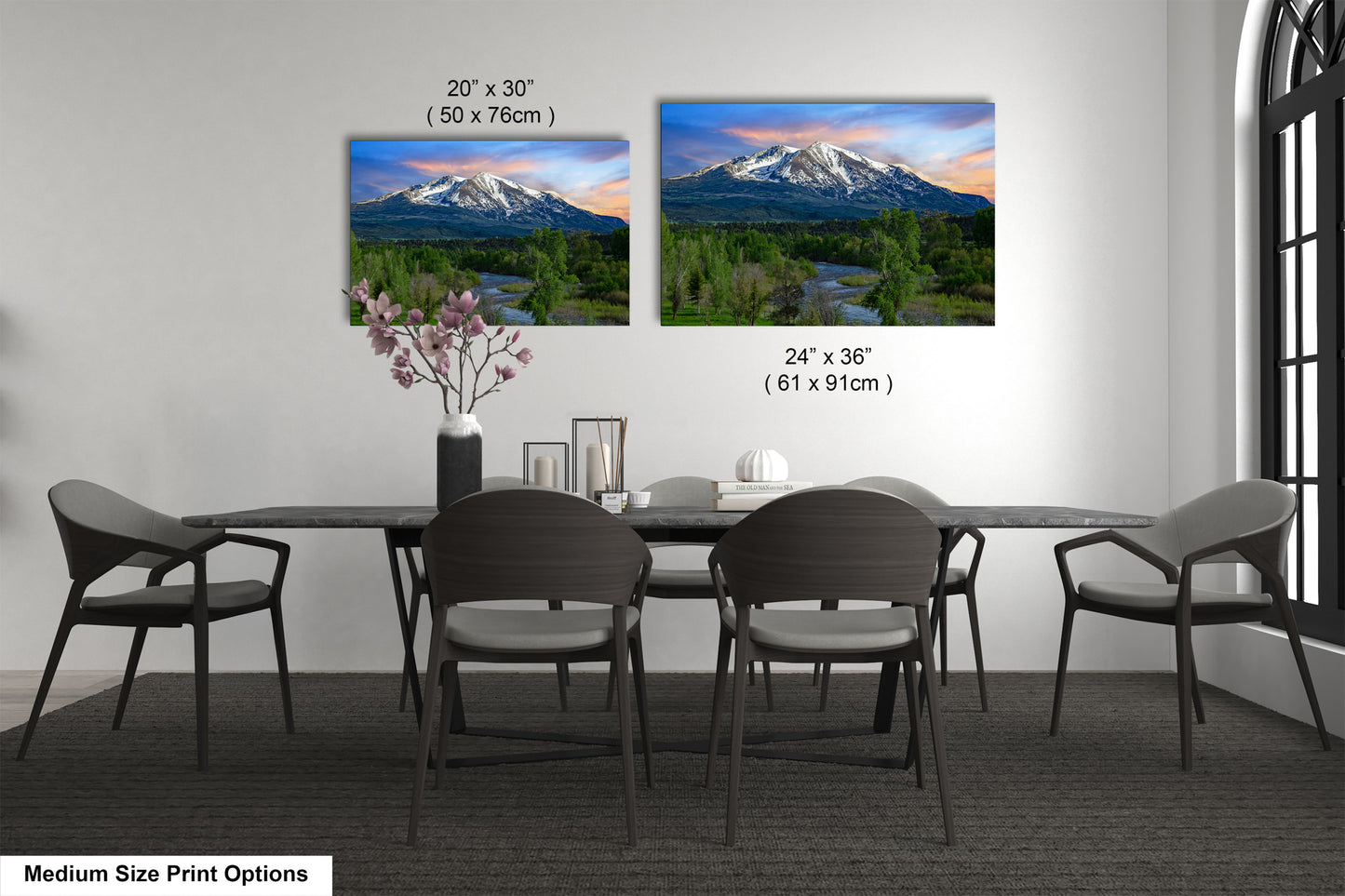 a dining room table with chairs and a vase with flowers
