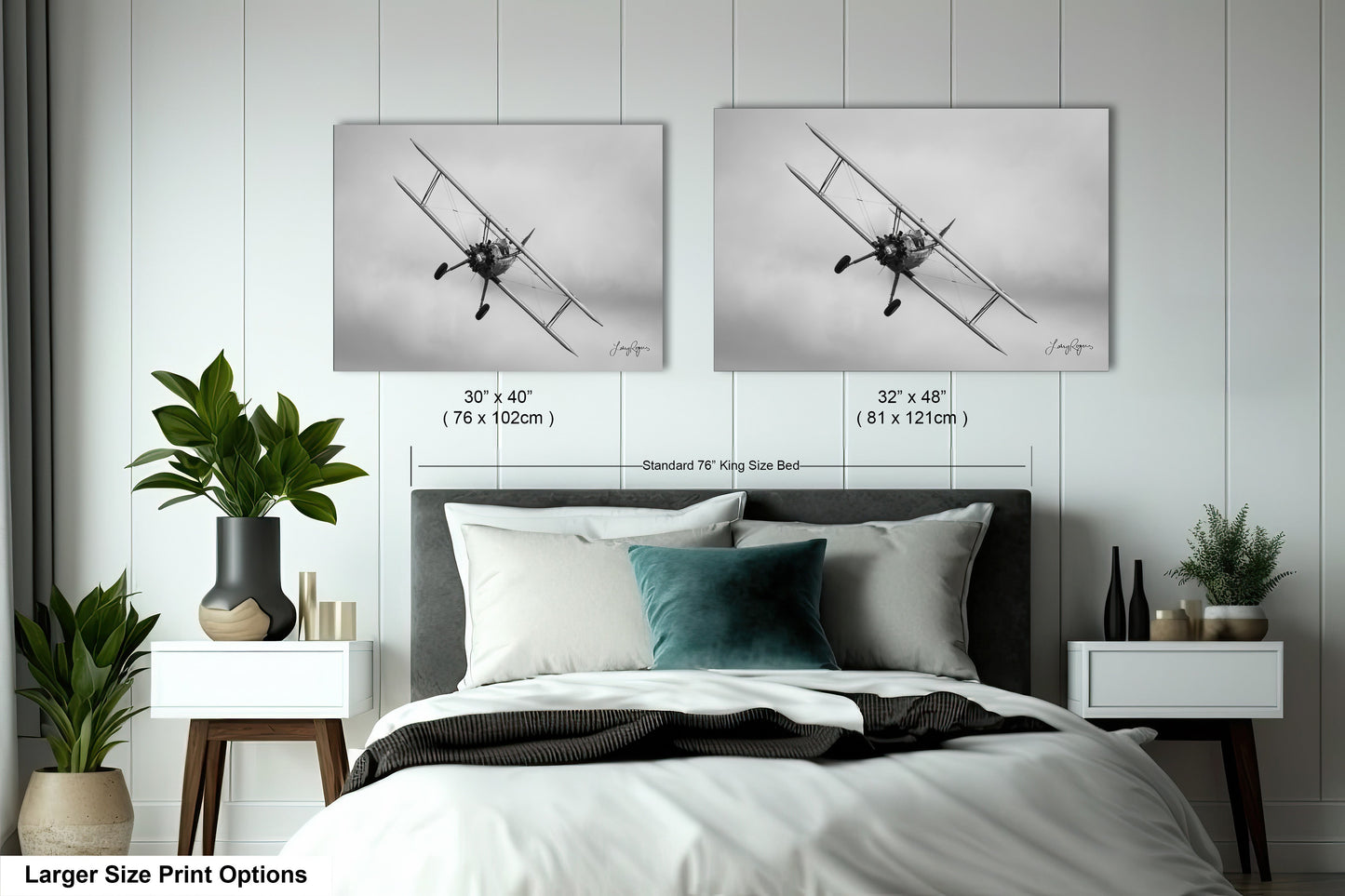 a bedroom with a bed and two pictures on the wall