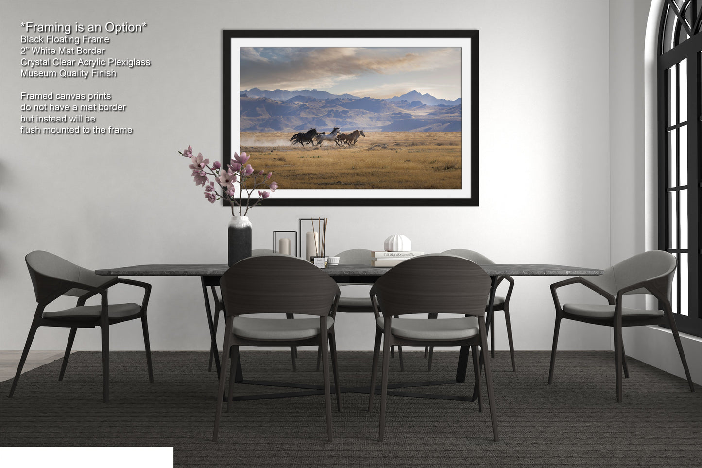 a dining room table with chairs and a picture hanging on the wall