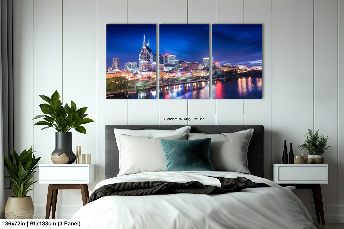 a bedroom with a large bed and a picture of a city