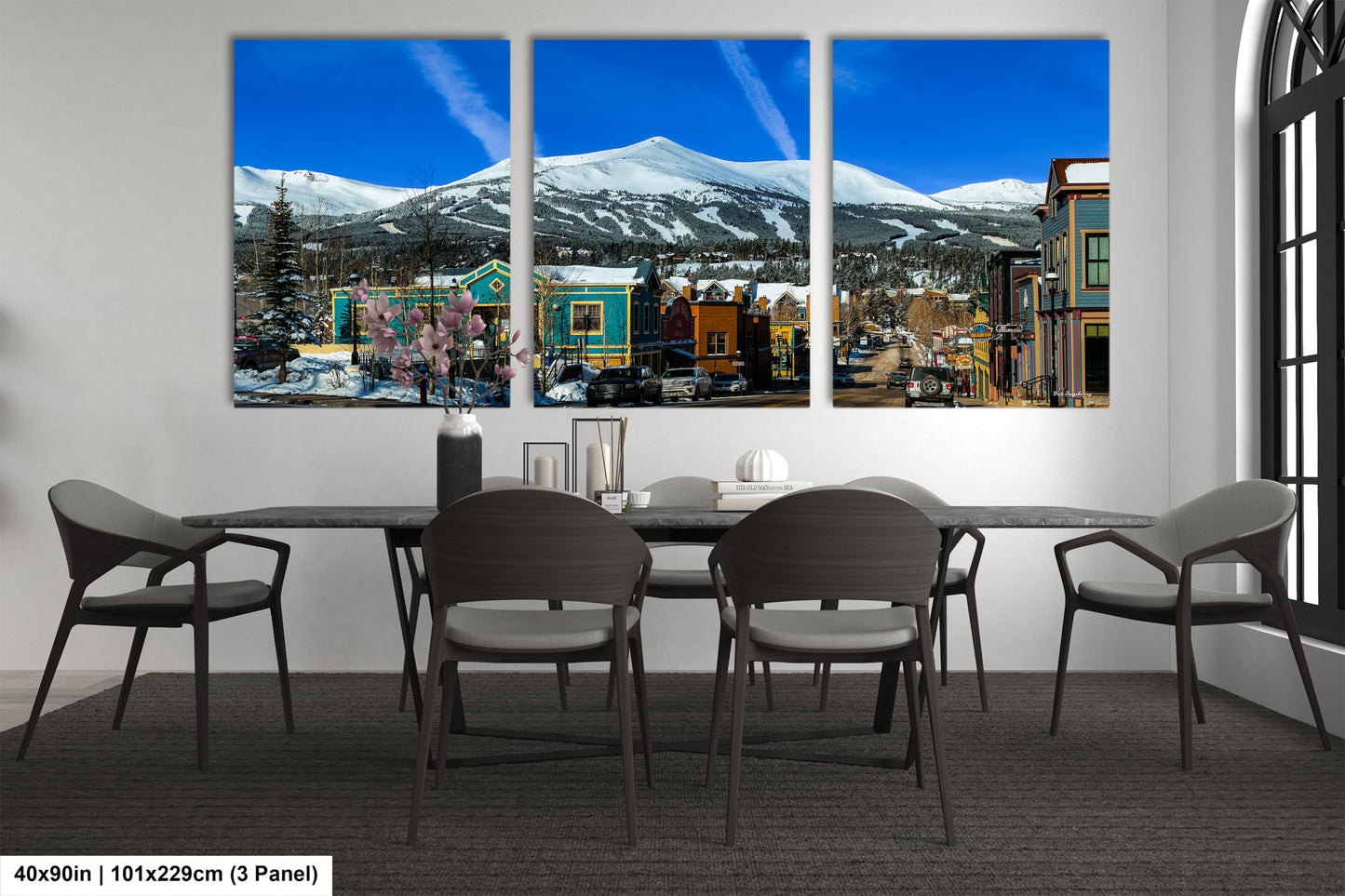 a dining room with a table and four chairs