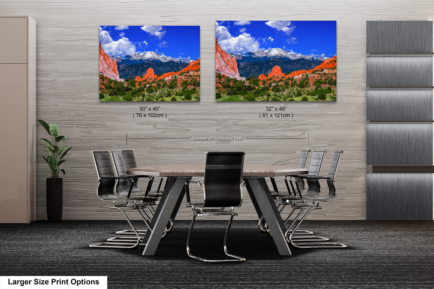 a dining room table with chairs and two pictures on the wall