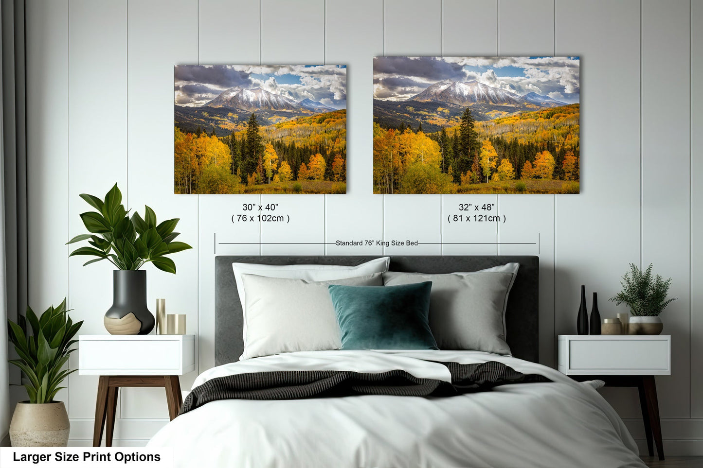 a bedroom with a bed and two pictures on the wall