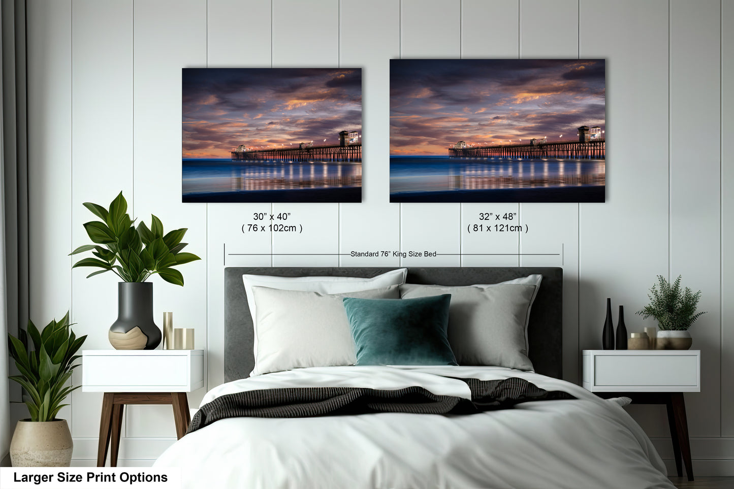 a bedroom with a bed and two pictures on the wall