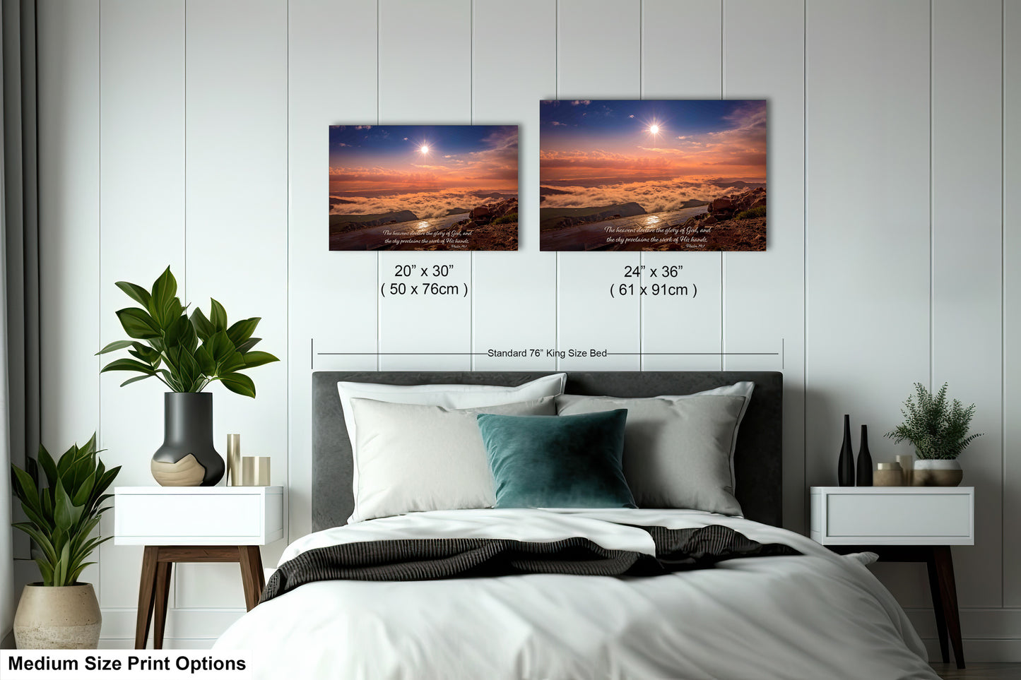a bed with two pictures on the wall above it