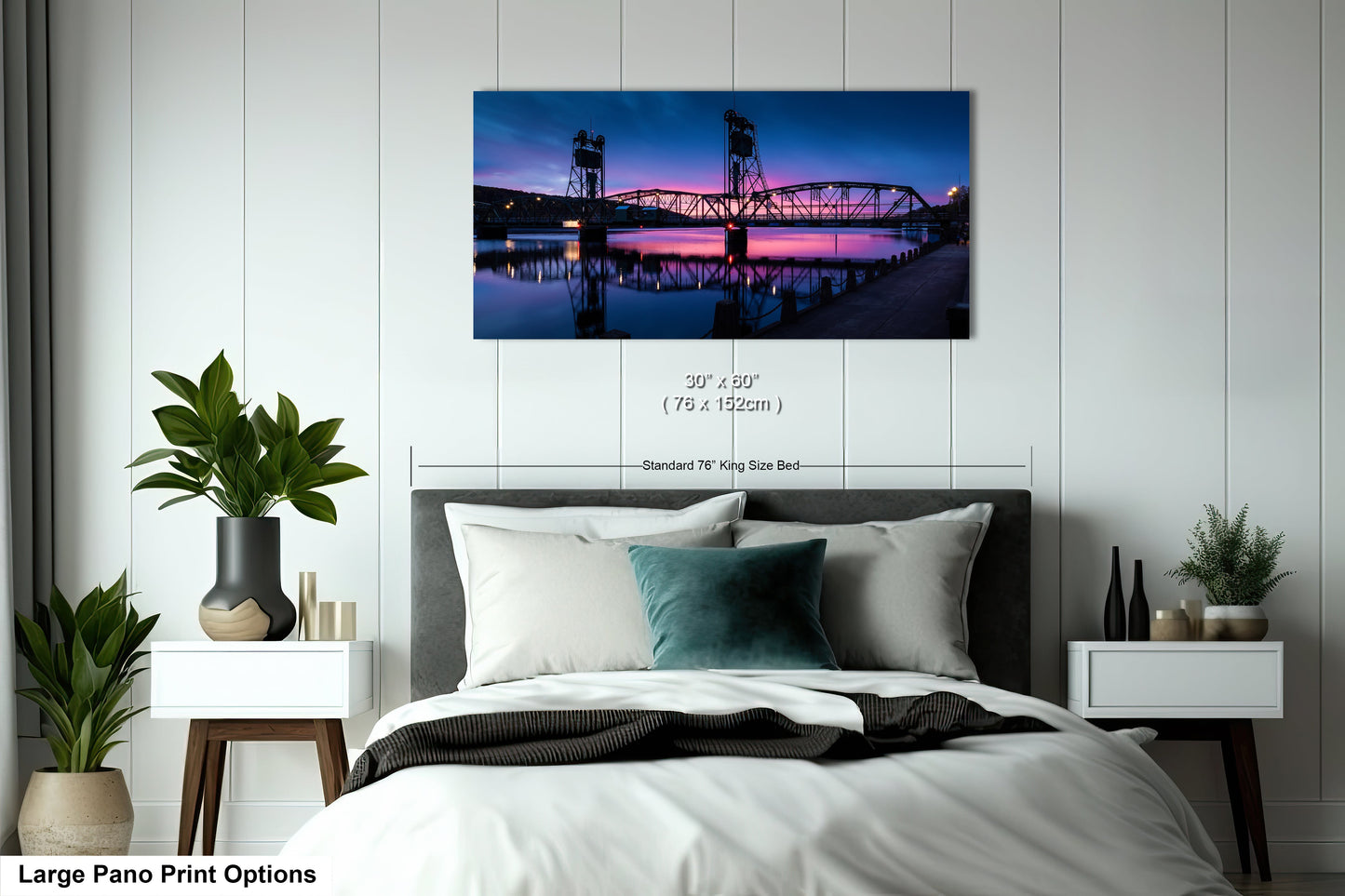 a bedroom with a large bed and a painting on the wall