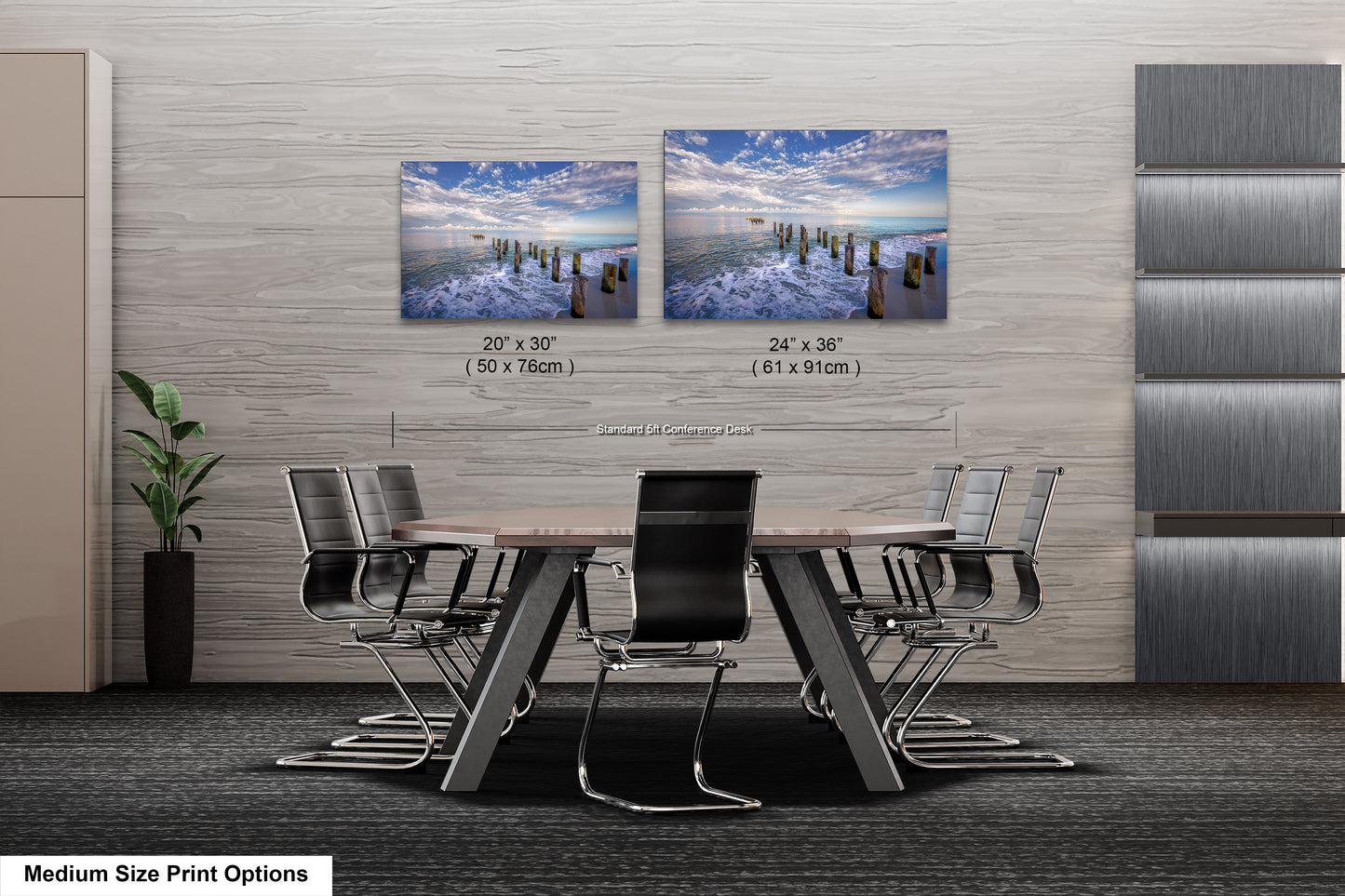 a dining room table with four chairs and two pictures on the wall