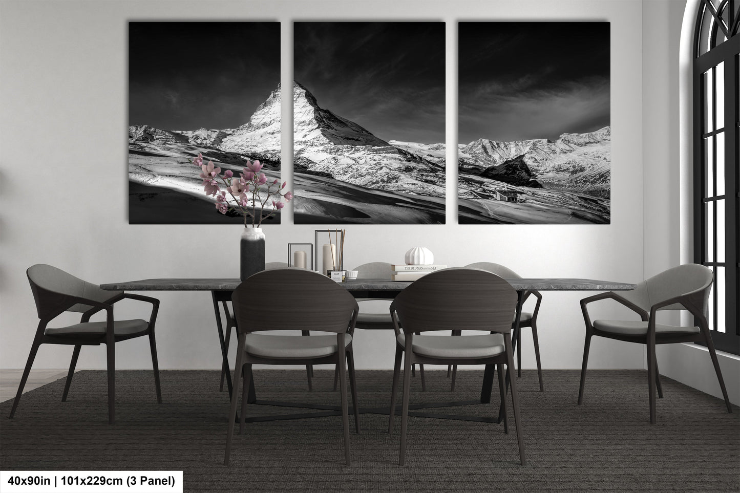 a black and white photo of a dining room table