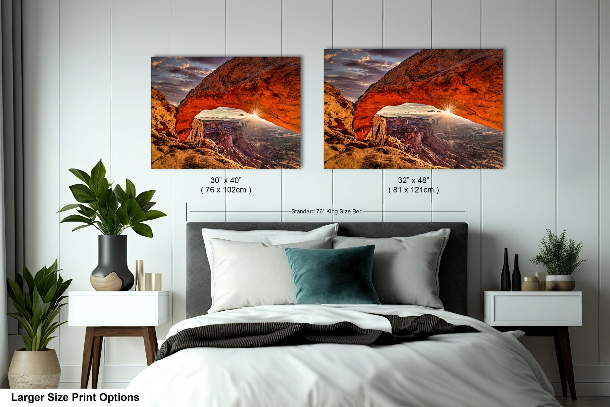a bed with two pictures on the wall above it