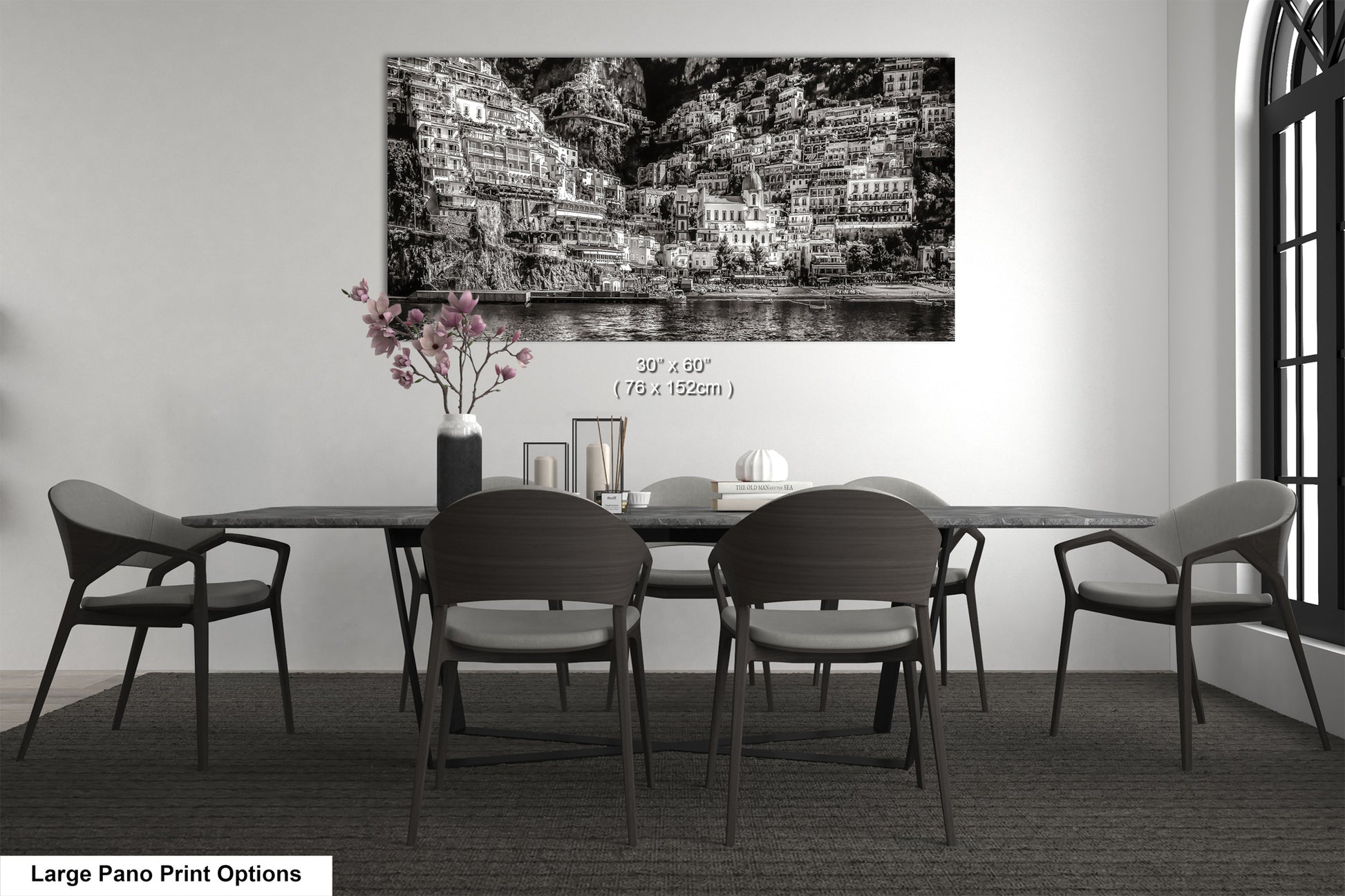 a black and white photo of a dining room table