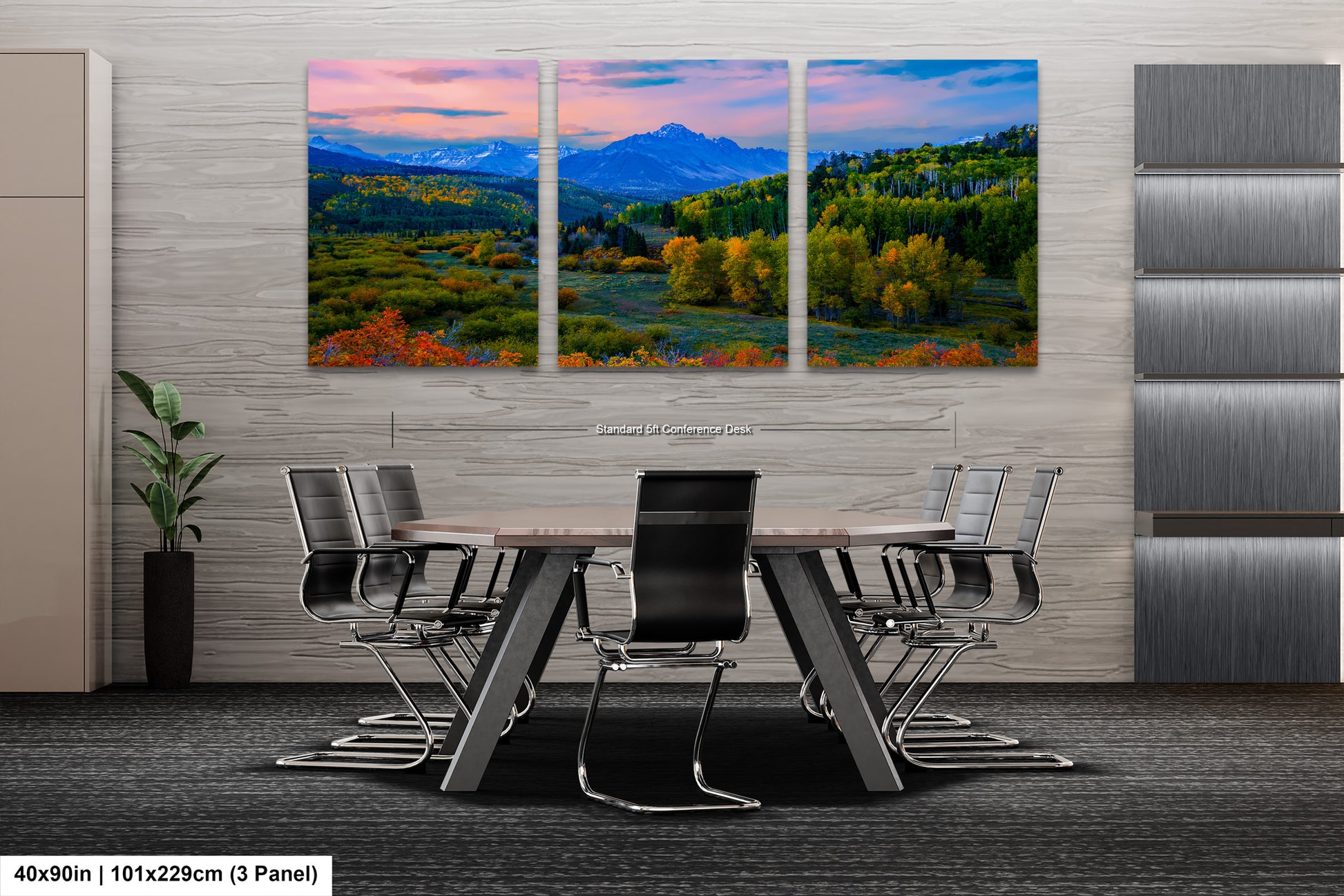 a dining room table with chairs and a painting on the wall