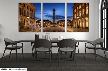 a dining room table with four chairs and a clock tower in the background