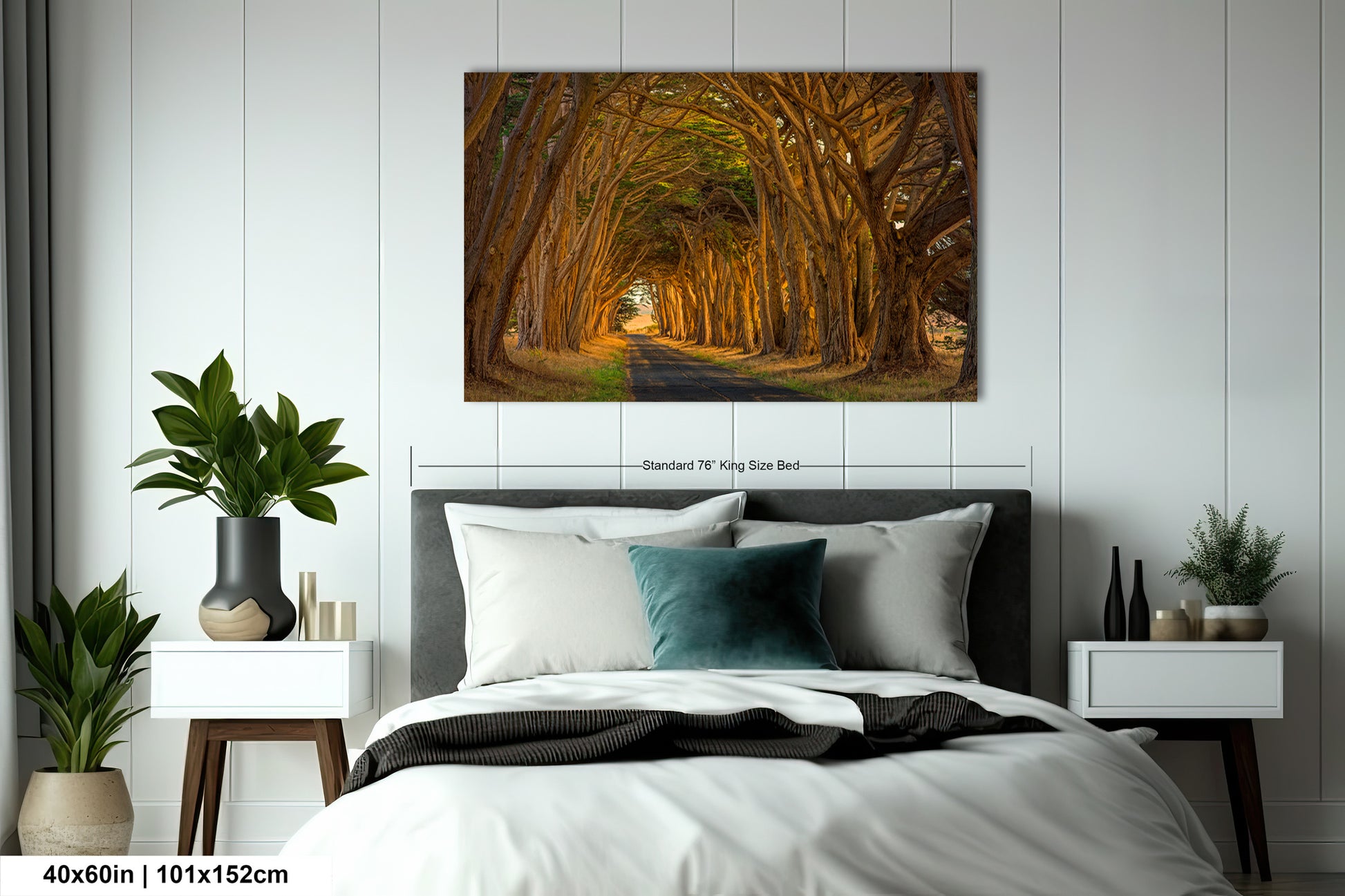 a bed room with a neatly made bed and a painting on the wall