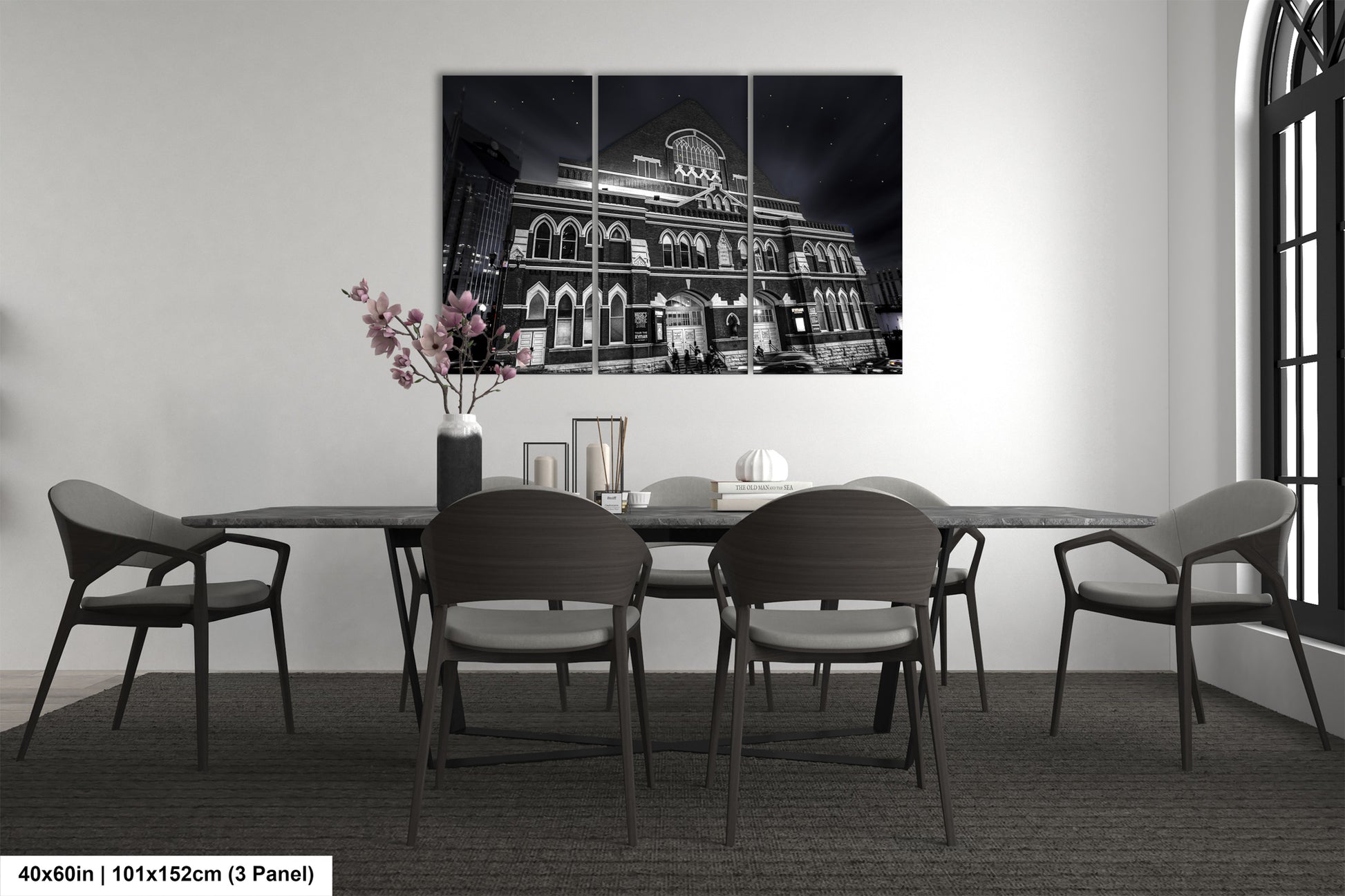 a black and white photo of a dining room