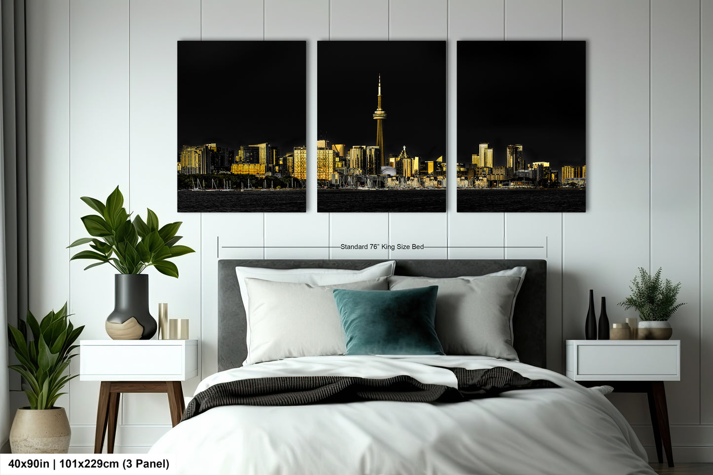 a bedroom with a large bed and two paintings on the wall