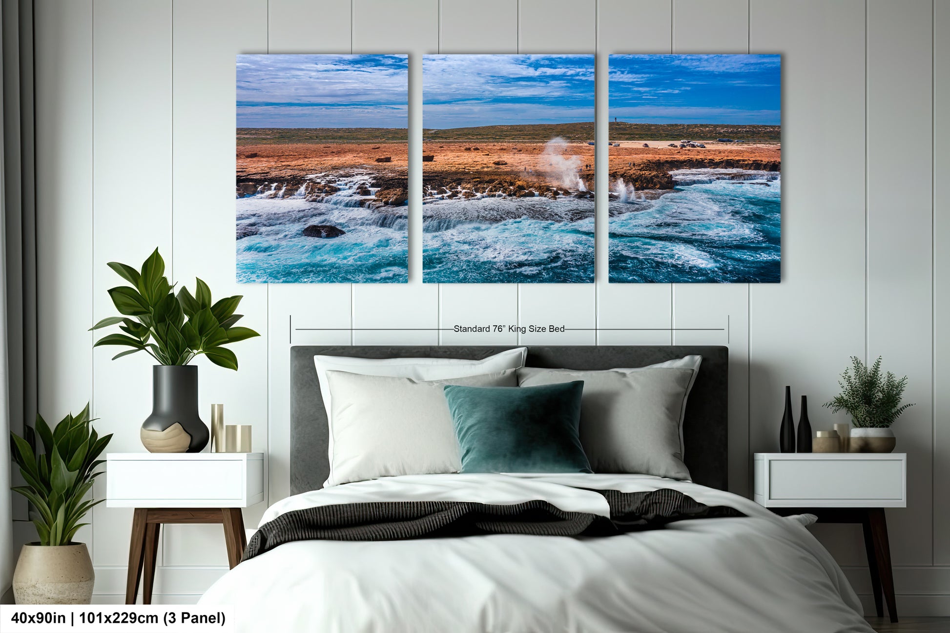 a bedroom with a bed and two paintings on the wall